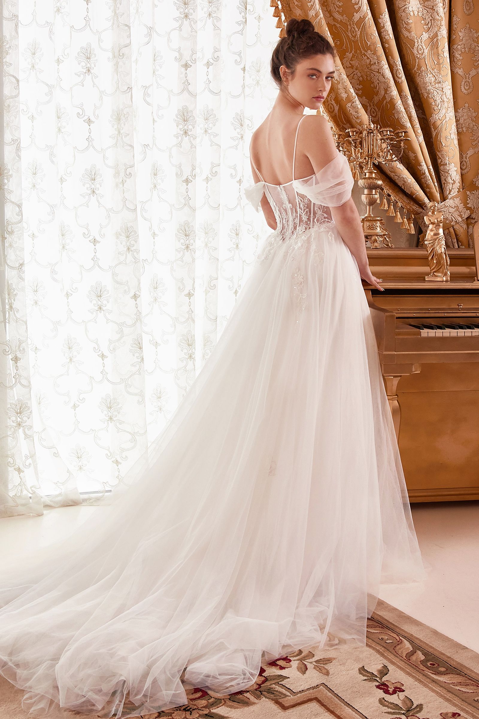 Feel truly magical on your special day with Ladivine WN307 A Line Tulle off the shoulder Sheer Corset Wedding Dress. Featuring a stunning off-the-shoulder draped sleeves sweetheart neckline look, the sheer boned corset bodice and intricate lace appliques make this dress the perfect choice for a timeless, yet contemporary style. 