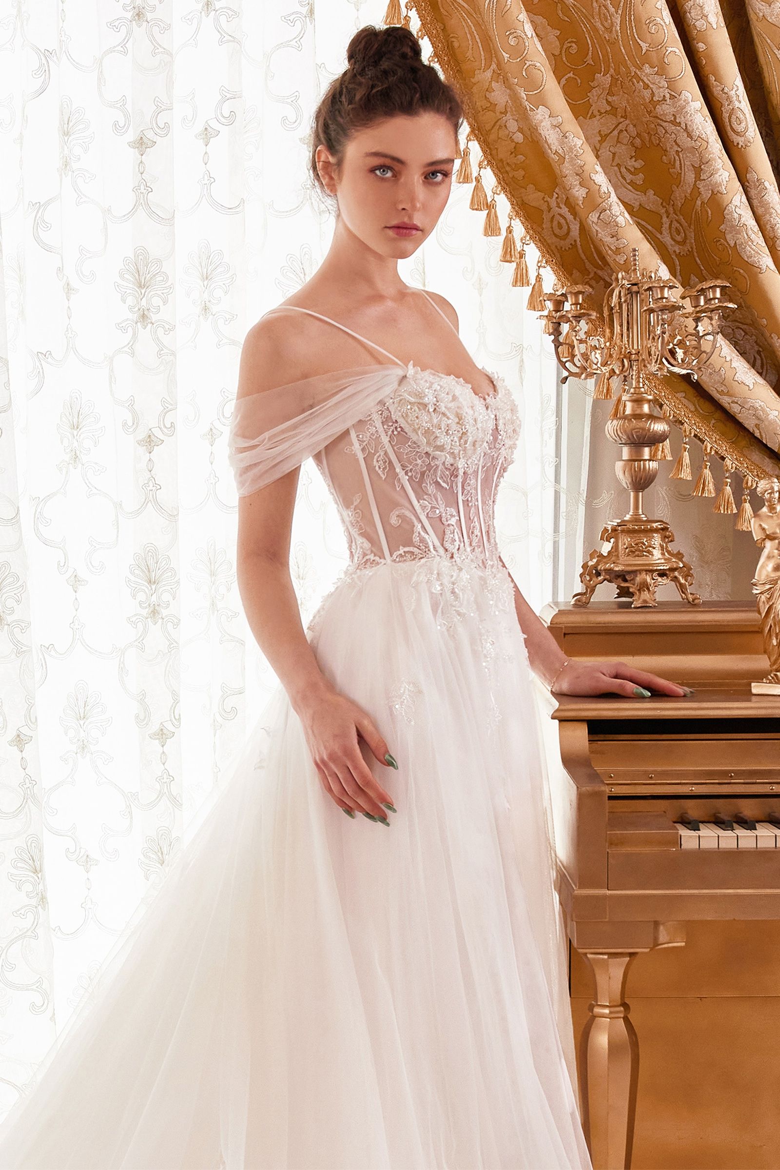 Feel truly magical on your special day with Ladivine WN307 A Line Tulle off the shoulder Sheer Corset Wedding Dress. Featuring a stunning off-the-shoulder draped sleeves sweetheart neckline look, the sheer boned corset bodice and intricate lace appliques make this dress the perfect choice for a timeless, yet contemporary style. 