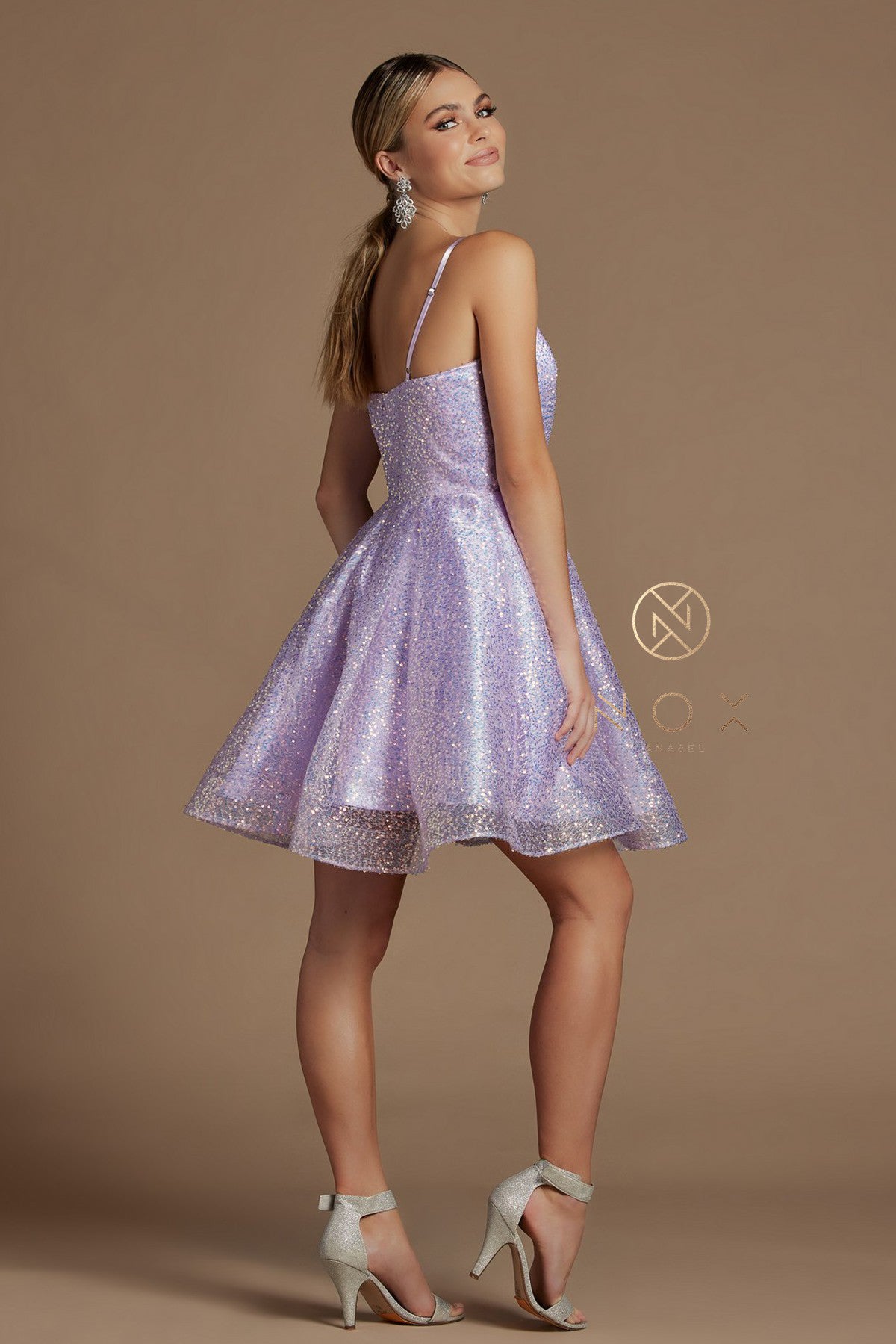 Nox Anabel R703 Short Fit & Flare Sequin Formal Cocktails Dress V Neck Gown Ruched V neckline with iridescent sequin accented fabric. Adjustable straps to avoid alterations!  Available Sizes: 2-16  Available Colors: Black/Multi, White/Multi, Lilac/Multi   
