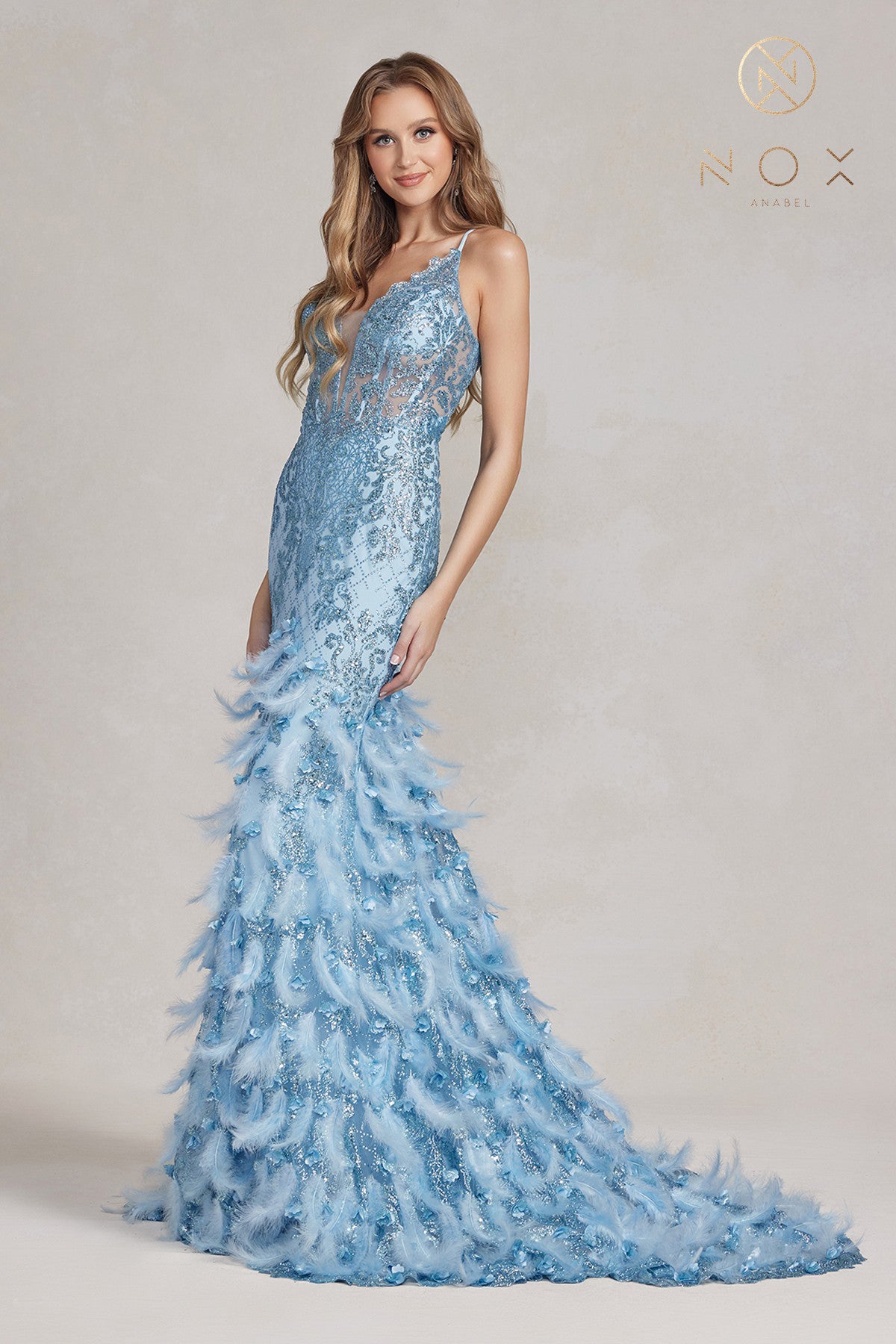 Nox Anabel C1111 Long Sheer Bodice with plunging neckline, Glitter 3D Lace embellished Feather Mermaid Skirt with train. Prom Dress Formal Evening Gown with corset back.  Sizes: 00-16  Colors: Black, Mauve, Light Blue