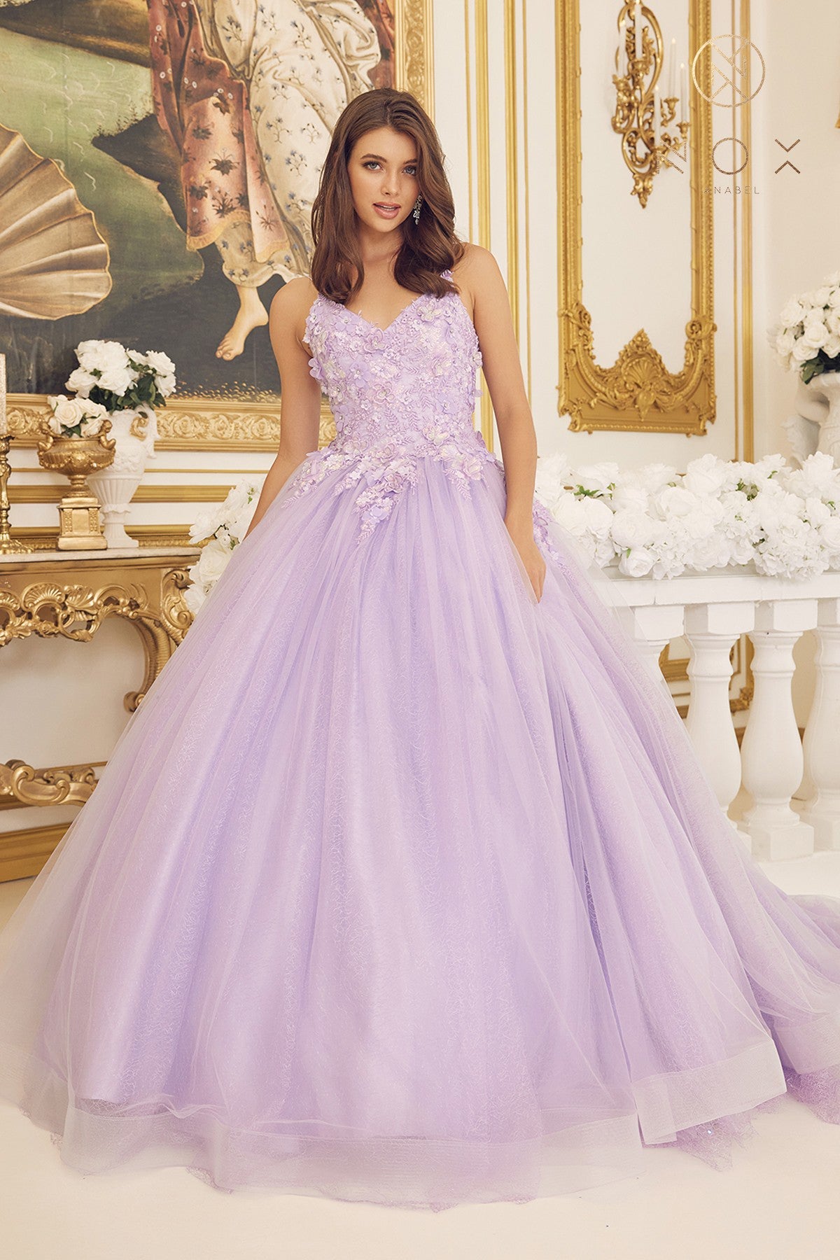 The Nox Anabel C1115 features a shimmering 3D lace sequin prom dress with a train formal gown. Designed with a luxurious satin material and a timeless silhouette, this dress is sure to make a glamorous statement. The elegant design and attention to detail give a timeless, graceful look.  Sizes: 4-16  Colors: Lilac, Emerald, Blue