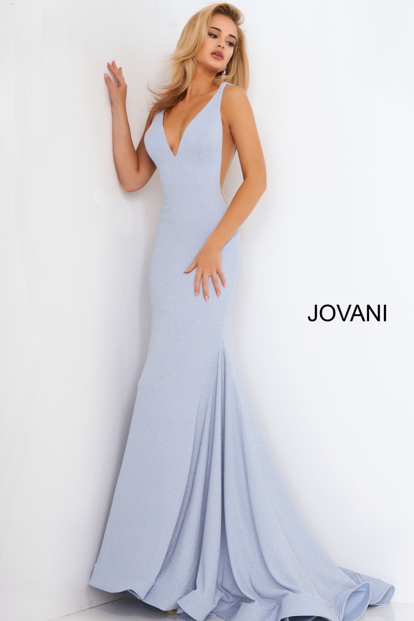 Jovani 02132 Blue V Neck Jovani Prom Dress 02132 Long Sexy Fitted Mermaid Prom Dress, Deep V Plunging Neckline with a Fit & Flare Shape Leading to a lush trumpet skirt with horse hair trim. Stretch Glitter fabric adds a touch of glam and a comfortable wear all night long!  Available Sizes: 00-24  Available Colors: blue, champagne, orange, pink