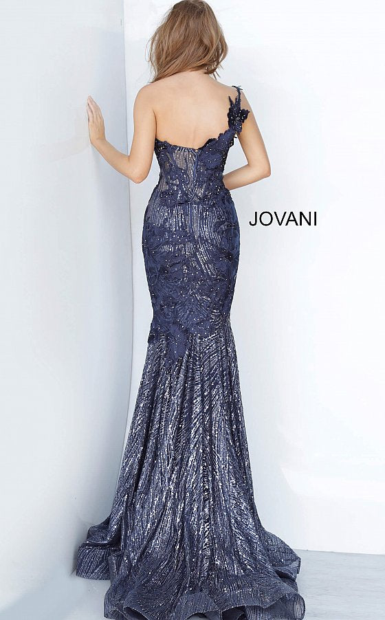 Jovani 02445 is a Navy Floral Lace embroidered and embellished lace mermaid evening gown with a one-shoulder sleeveless sheer bodice featuring corset boning and a sweetheart neckline. Floor-length fitted skirt with a flared mermaid tail end and sweeping train. Glitter & Sequin Embellished Formal Gown for Pageants, Mother Of, Red Carpet, Prom & So Much more! 