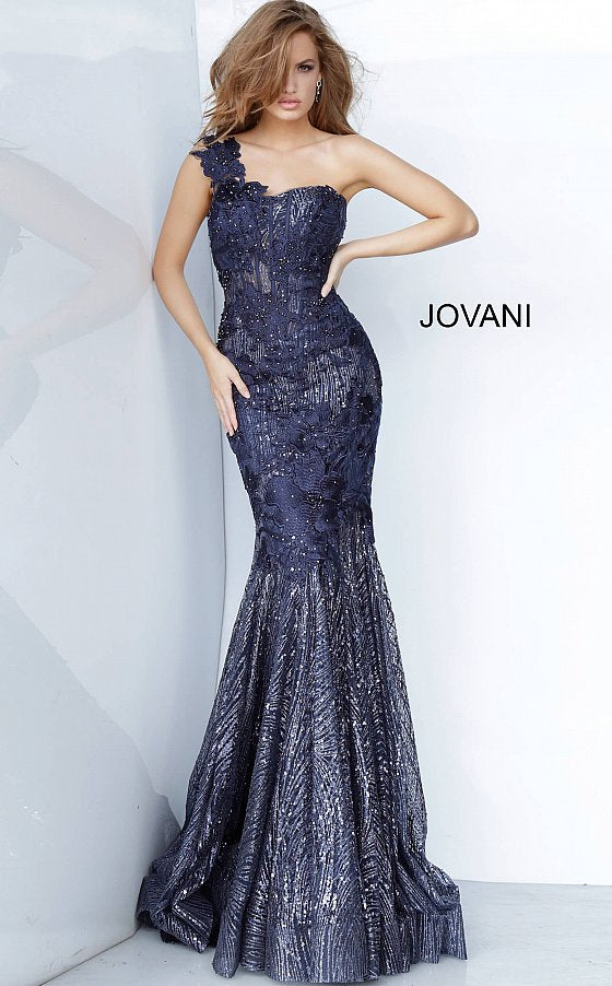 Jovani 02445 is a Navy Floral Lace embroidered and embellished lace mermaid evening gown with a one-shoulder sleeveless sheer bodice featuring corset boning and a sweetheart neckline. Floor-length fitted skirt with a flared mermaid tail end and sweeping train. Glitter & Sequin Embellished Formal Gown for Pageants, Mother Of, Red Carpet, Prom & So Much more! 