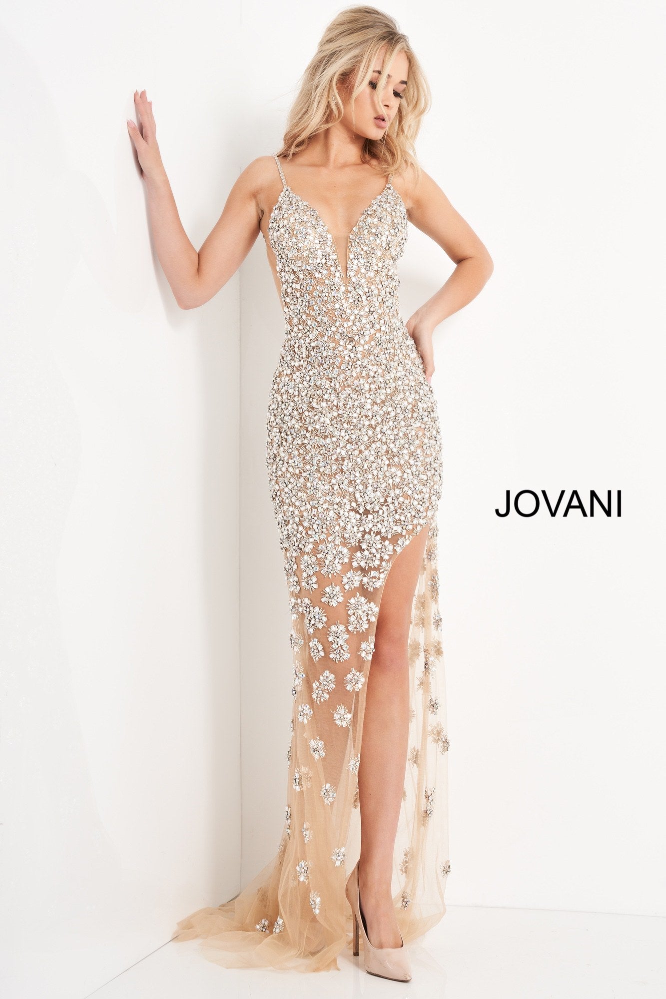 Jovani 02492 is a Stunning Nude Sheer formal evening gown. Red Carpet Ready! Plunging deep V Neckline with embellished spaghetti straps. open back, Backless, This gown features a wide side slit and sheer skirt with sweeping train. Fully Embellished with Crystal Rhinestones, Sequins & Beading. Great Special event Gown! Available Sizes: 00,0,2,4,6,8,10,12,14,16,18,20,22,24  Available Colors: Nude