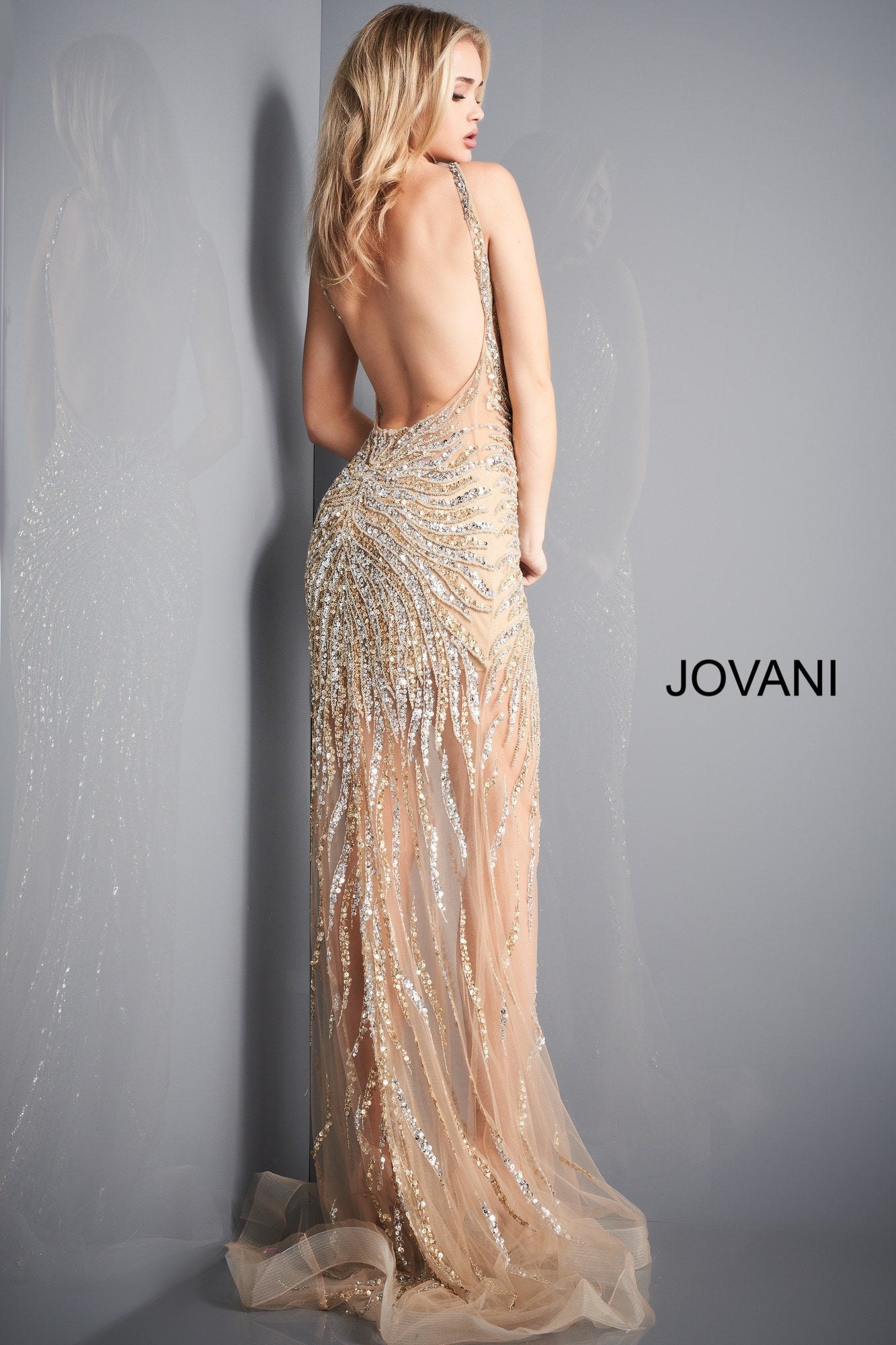 Jovani 02504 is a long fitted formal evening gown. V neckline with an open back. This Backless formal evening gown Features a fully Embellished & Beaded design with sequins cascading down into the sheer long trumpet skirt with horse hair trim. Fitted sheer bodice with cascading asymmetrical embellishments for a flattering fit. Sweeping train. This is a sexy style for any Formal Event! Available Sizes: 00,0,2,4,6,8,10,12,14,16,18,20,22,24  Available Colors: Burgundy, Light Blue, Gold/Silver