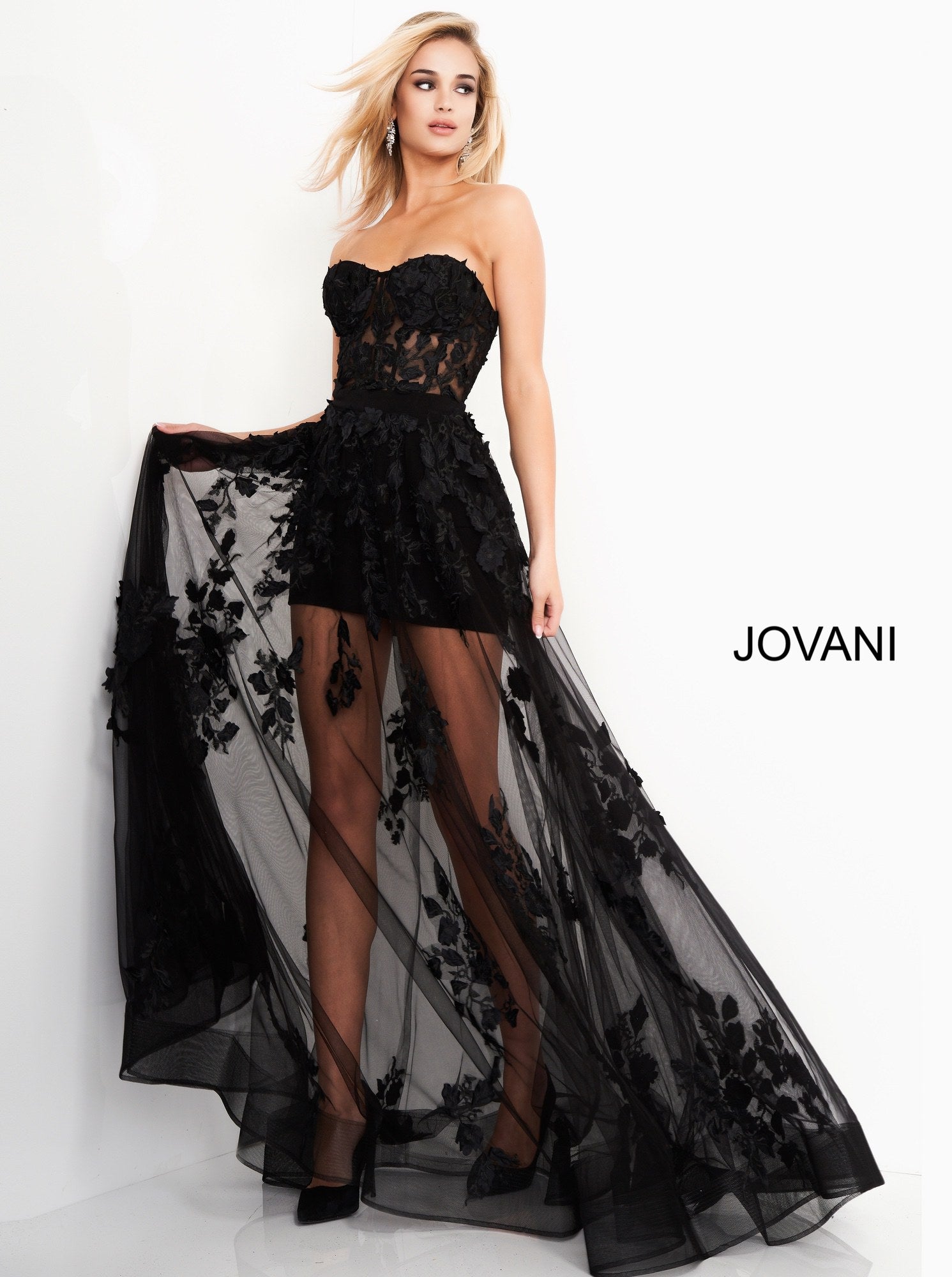 Jovani 02845 is a 2020 maxi prom dress with a mini skirt under skirt. Sheer lace Embellished floral appliques. Sheer Strapless corset bodice with boning. Sheer Corset Maxi Skirt Prom Dress Mini Lace Sexy Formal Gown 2020