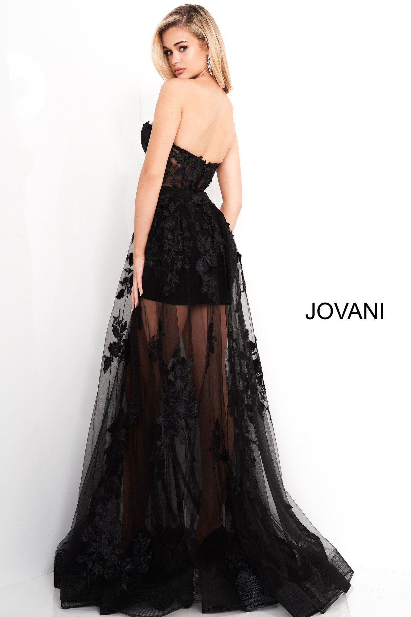 Jovani 02845 is a 2020 maxi prom dress with a mini skirt under skirt. Sheer lace Embellished floral appliques. Sheer Strapless corset bodice with boning. Sheer Corset Maxi Skirt Prom Dress Mini Lace Sexy Formal Gown 2020