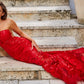 Jovani 02895 is a long fitted one shoulder formal prom dress.  Featuring a sheer fitted bodice and skirt. Sequin embellished lace appliques. Mermaid silhouette. sheer side panels with mesh insert. sweeping train with horse hair trim. Great Prom & Pageant Dress.  Available Sizes: 00,0,2,4,6,8,10,12,14,16,18,20,22,24  Available Colors: black, forest, light-blue, red, rose/gold, royal, white, yellow
