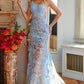 Jovani 02895 is a long fitted one shoulder formal prom dress.  Featuring a sheer fitted bodice and skirt. Sequin embellished lace appliques. Mermaid silhouette. sheer side panels with mesh insert. sweeping train with horse hair trim. Great Prom & Pageant Dress. light blue front