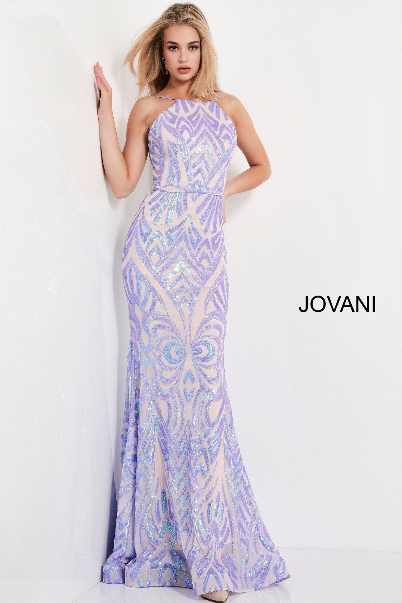 Jovani 03446 This is a long fit and flare prom dress with a high neckline and backless design.  It has a beaded sequins pattern throughout.  Lilac  Size 12