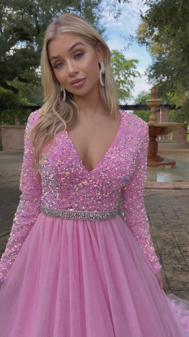 Ava Presley 38332 Long Sleeve Velvet Sequin Bodice with a V Neckline. Glitter Shimmer A Line Ballgown skirt with a crystal rhinestone waistband. full modest back coverage. Prom Dress Pageant Gown.  Sizes: 00-24  Colors: Royal, Red, Iridescent White, Iridescent Pink, Iridescent Light Blue