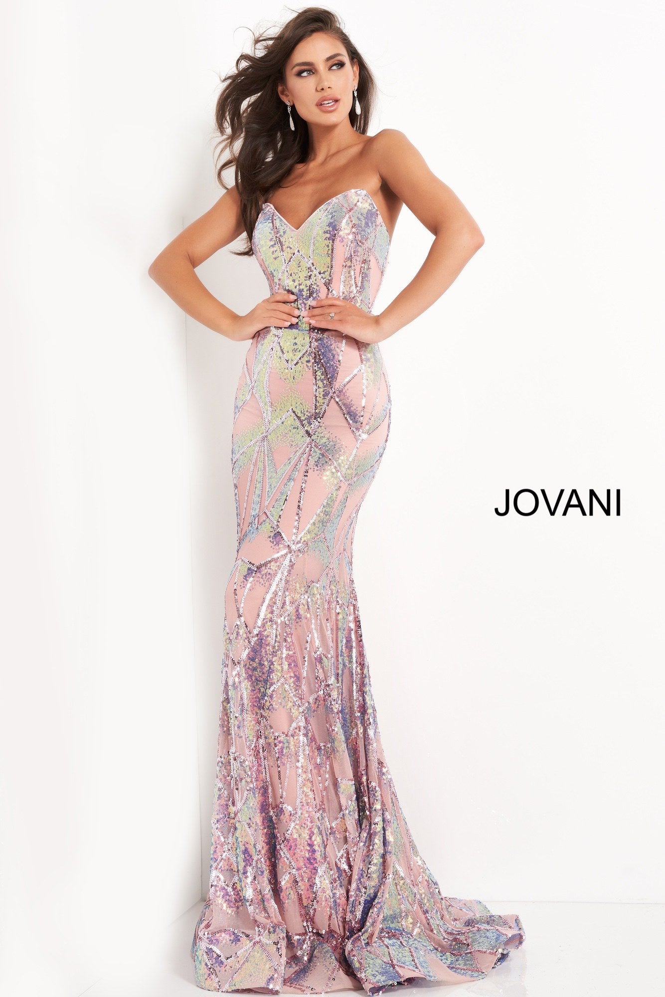 Jovani 05100 is a long Fitted formal evening gown. Featuring a strapless peak - deep sweetheart neckline. This stunning Pageant & Prom Gown is Fully Embellished with Glitter & Sequins to Create A Glamorous Geometric dimensional design. Mermaid silhouette with a lush trumpet skirt & sweeping train.  Available Sizes: 00,0,2,4,6,8,10,12,14,16,18,20,22,24  Available Colors: black/multi, light-blue, navy, pink