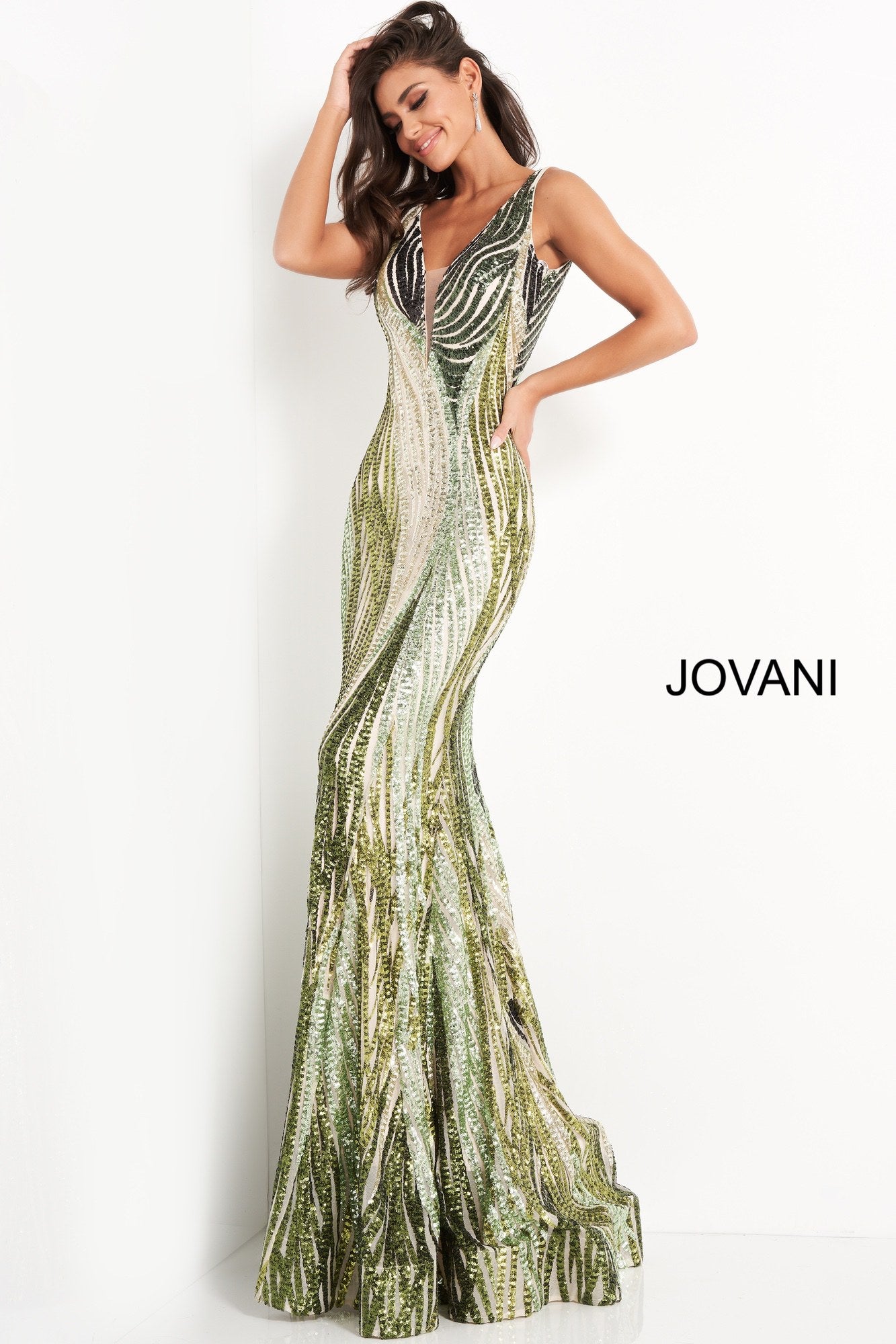 Jovani 05103 is a Long Fitted Mermaid Prom Dress. Featuring a Depp V Plunging Neckline with mesh insert. Green Sequin Multi Embellished Bodice cascading into the lush trumpet skirt. This Pageant Dress Features a sweeping train perfect for the stage!  Available Sizes: 00,0,2,4,6,8,10,12,14,16,18,20,22,24  Available Colors: Green