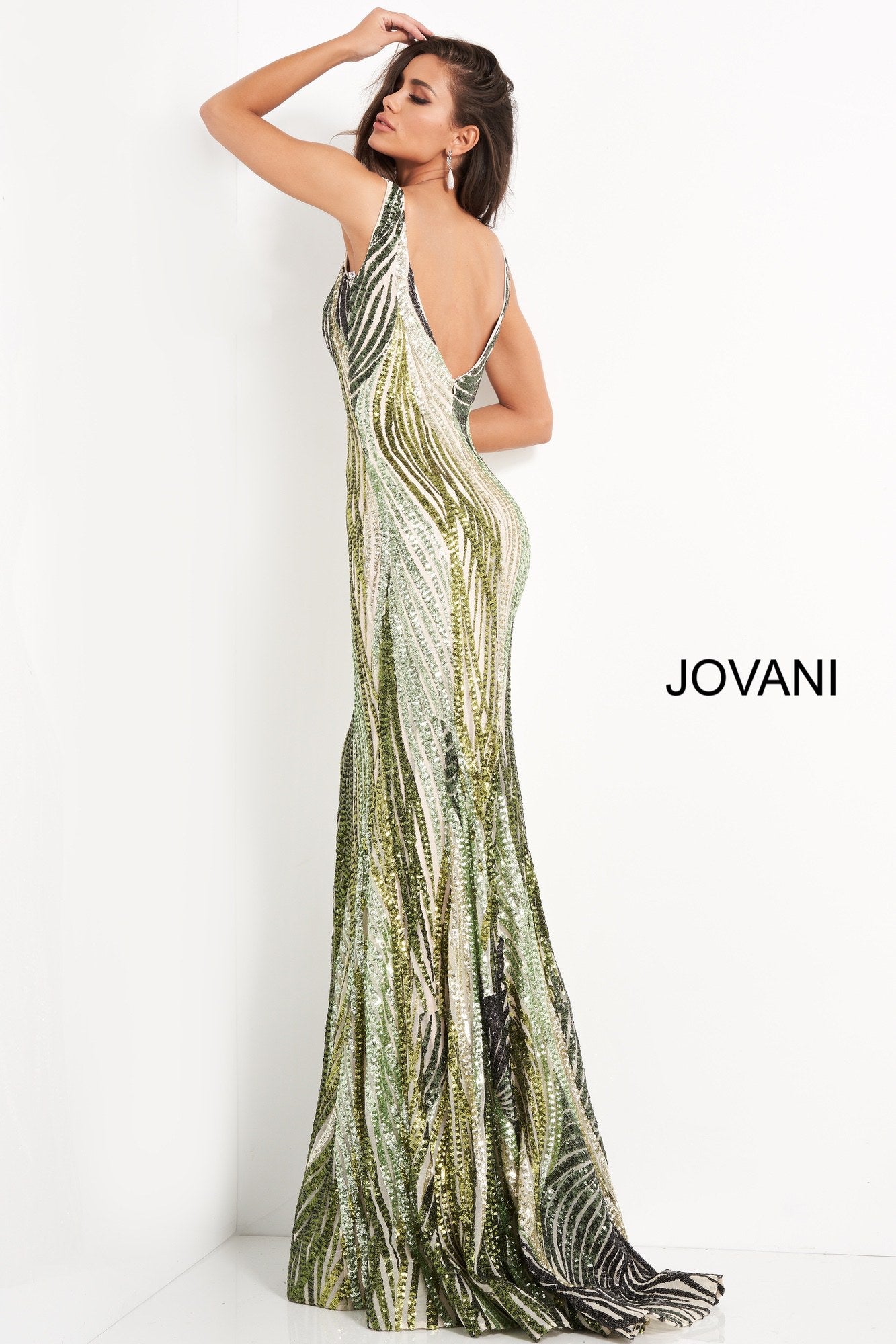 Jovani 05103 is a Long Fitted Mermaid Prom Dress. Featuring a Depp V Plunging Neckline with mesh insert. Green Sequin Multi Embellished Bodice cascading into the lush trumpet skirt. This Pageant Dress Features a sweeping train perfect for the stage!  Available Sizes: 00,0,2,4,6,8,10,12,14,16,18,20,22,24  Available Colors: Green