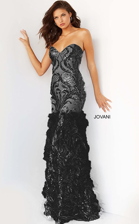 Jovani 05667 This is a long prom dress with feather details on the bottom of the skirt.  This pageant gown has a sweetheart neckline and is strapless.  Perfect evening gown for a Red Carpet event. Black
