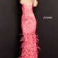 Jovani 05667 This is a long prom dress with feather details on the bottom of the skirt.  This pageant gown has a sweetheart neckline and is strapless.  Perfect evening gown for a Red Carpet event. Fuchsia