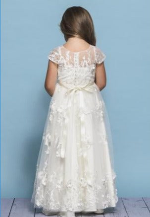 Rosebud Fashions Style 5137 is a full length dress featuring a 3D flower and vine motif with an illusion bodice and cap sleeves. The ribbon at the waist ties to a bow in the back. Satin buttons cover the zipper. Floral Applique Flower Girl Dress. 