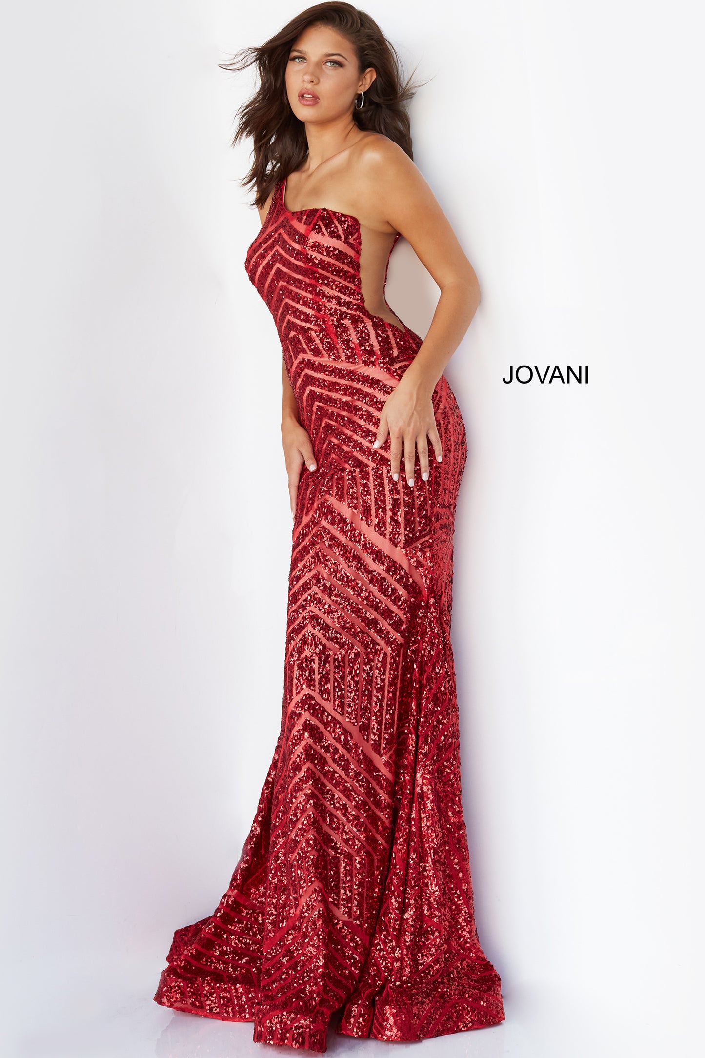 Jovani 06017 Long Mermaid Prom Pageant Gown Sequin One Shoulder Formal Sheer This Jovani 06017 red prom gown features a fit and flare silhouette in geometric sequins, detailed with a one-shoulder neckline and sheer plunging sides. Soft godets add volume to this glitter formal dress, finished with a horsehair hem and sweep train. Available Size-00-24  Available Color- Red, Purple, Blush, Neon Hot Pink