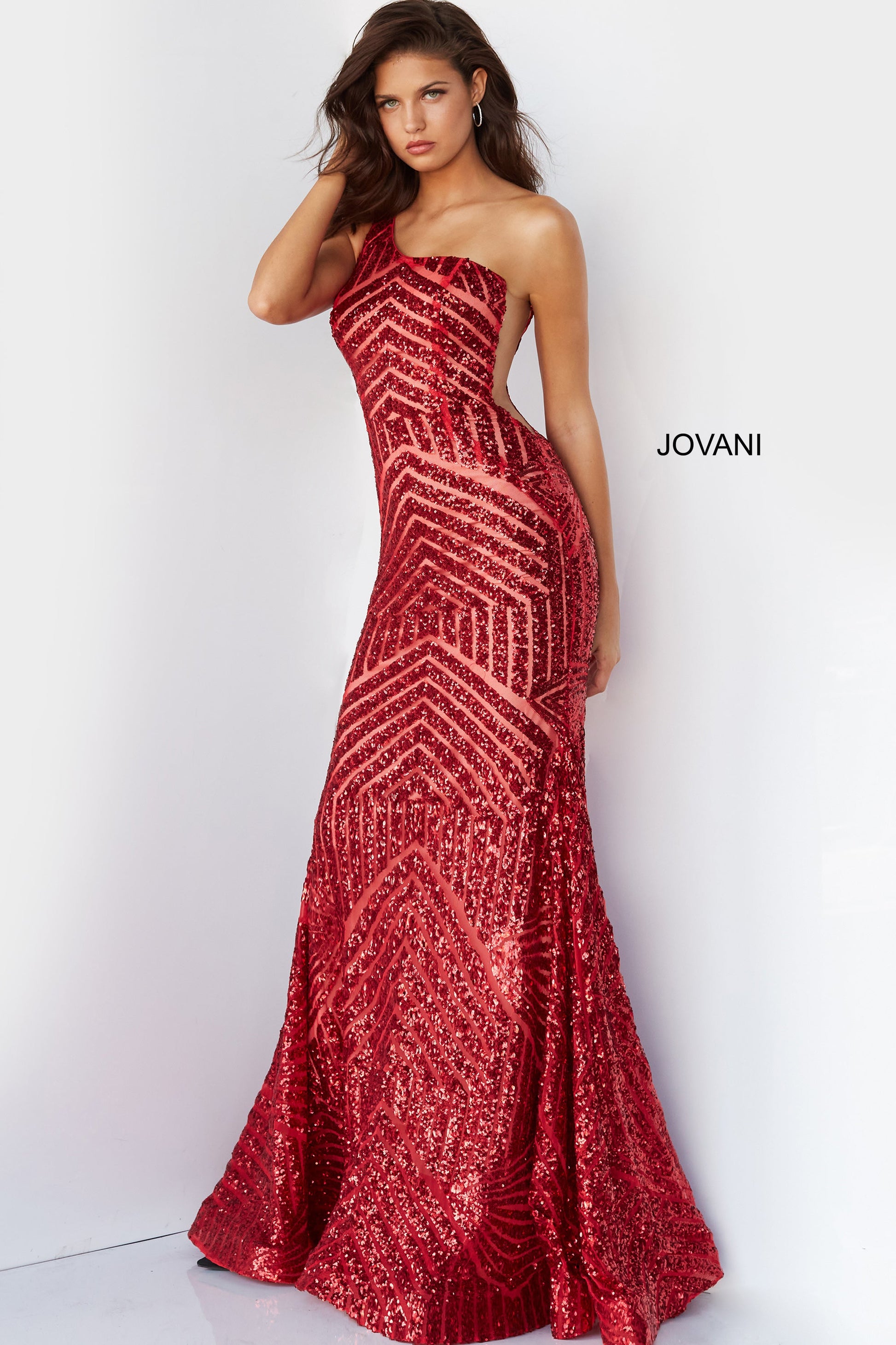 Jovani 06017 Long Mermaid Prom Pageant Gown Sequin One Shoulder Formal Sheer This Jovani 06017 red prom gown features a fit and flare silhouette in geometric sequins, detailed with a one-shoulder neckline and sheer plunging sides. Soft godets add volume to this glitter formal dress, finished with a horsehair hem and sweep train. Available Size-00-24  Available Color- Red, Purple, Blush, Neon Hot Pink