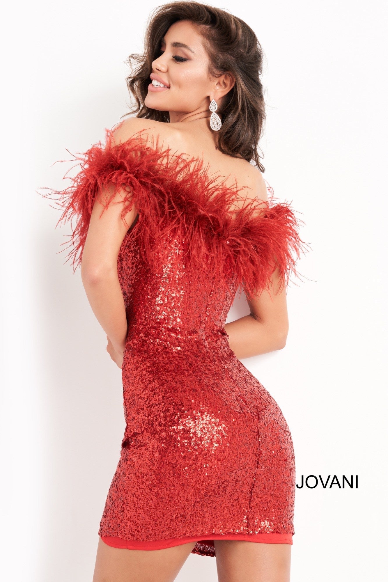 Jovani 06167 is a short fitted sequin cocktail evening dress. Featuring a straight neckline with off the shoulder feather embellished straps. Fitted Stretch Sequin bodice is perfect for any formal event or occasion! Sexy wedding reception dress in Ivory or Little black dress.  Available Sizes: 00,0,2,4,6,8,10,12,14,16,18,20,22,24  Available Colors: Black, Red, Ivory