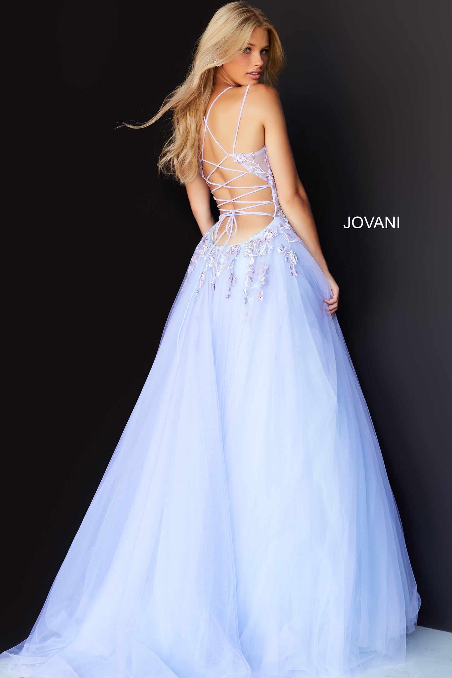Jovani 06207 Lilac Prom Dress by Jovani.  V neckline sheer floral embellished corset bodice with a v neckline and crisscross tie open low back.  Tulle skirt. 
