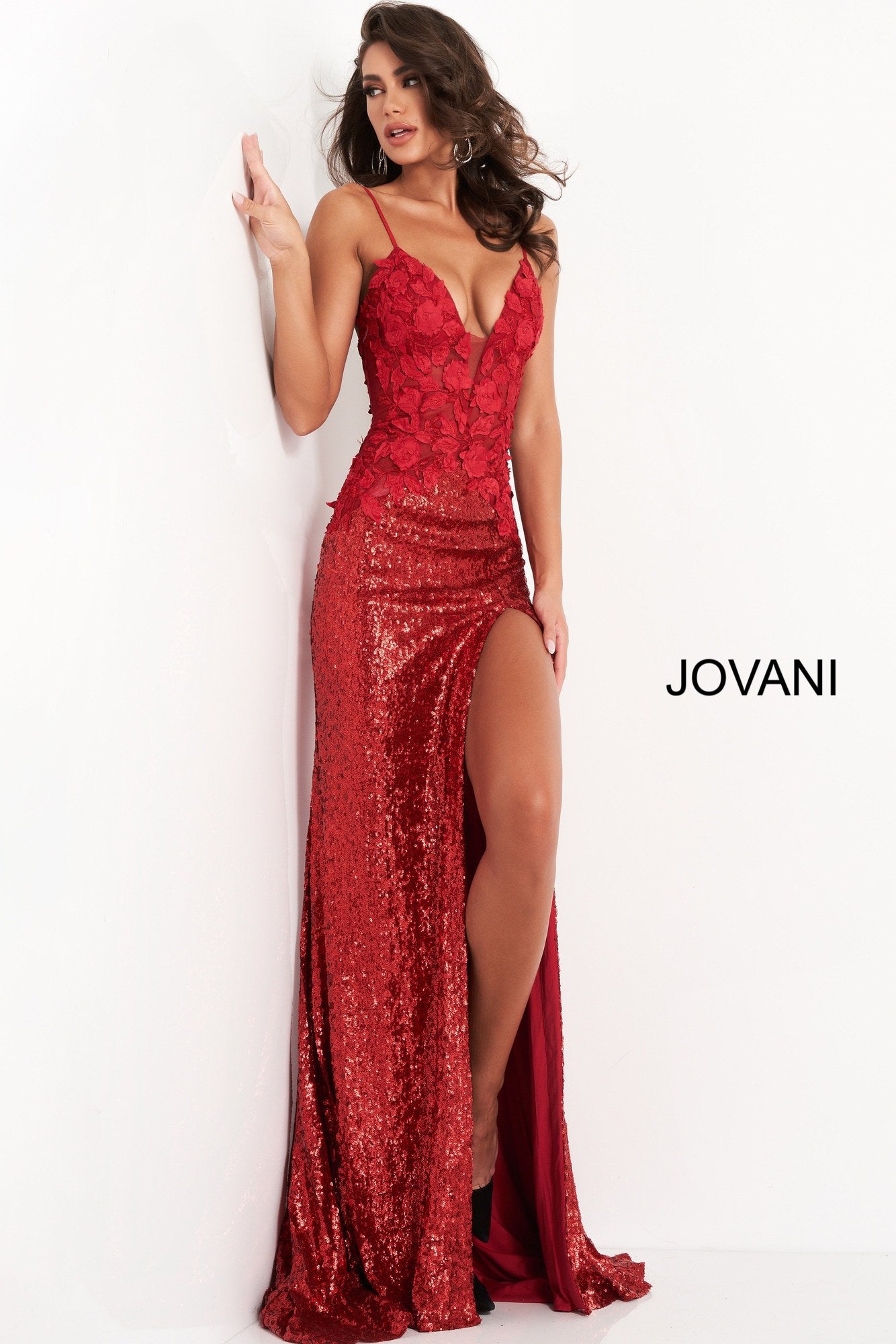 Jovani 06426 is a Long Fitted Stretch Petite Sequin Shimmering Formal Evening Gown. This Stunning Prom Dress Features a Deep V  Plunging Neckline and Detailed floral Appliques. spaghetti straps lead around to an open back. This Backless Pageant Gown throws a glamorous appeal with its lush sweeping sequin train! Sexy thigh Slit in skirt. Available Sizes: 00,0,2,4,6,8,10,12,14,16,18,20,22,24  Available Colors: Black, Cream, Red, Light Blue