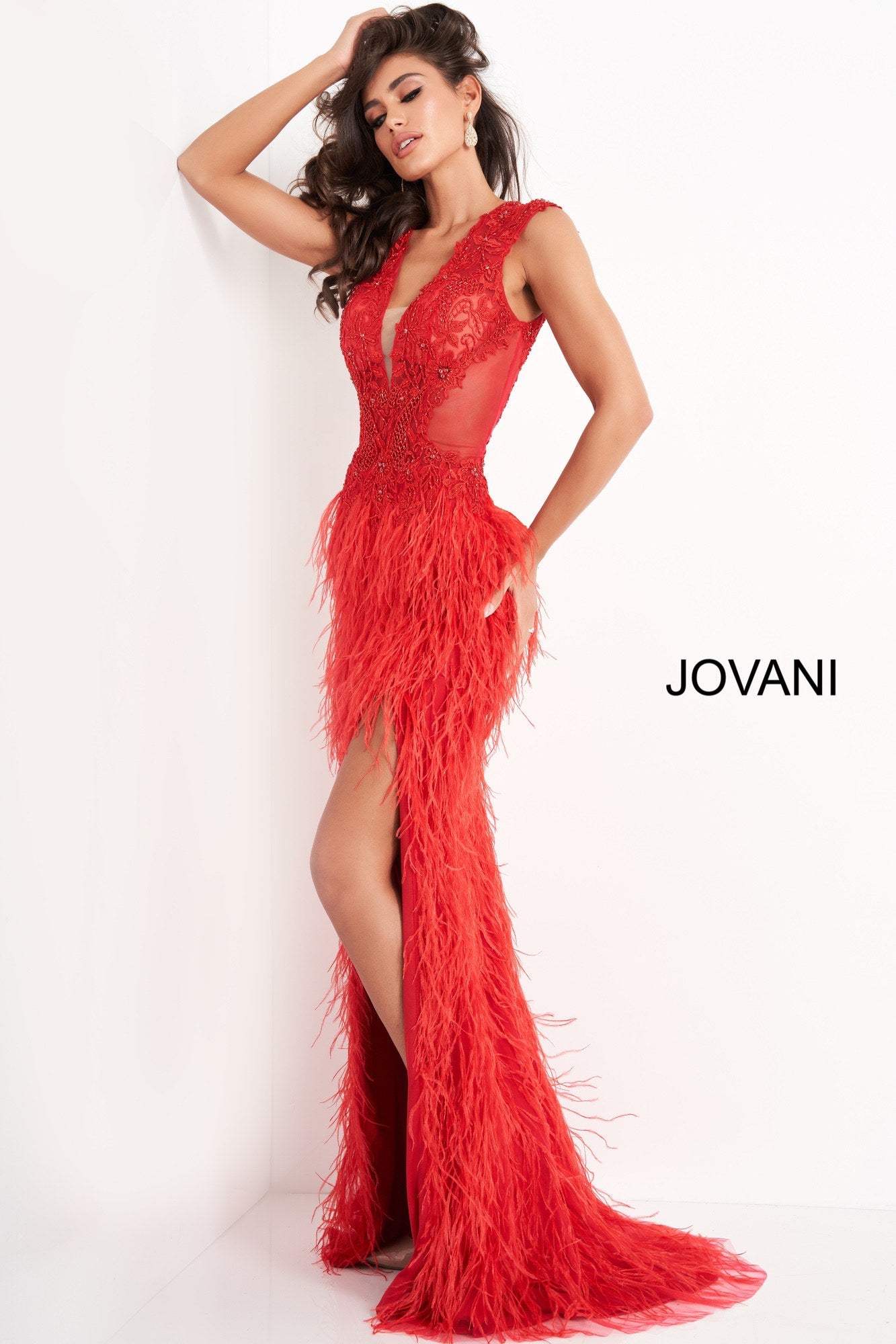 Jovani 06446 is a Gorgeous Red Carpet Ready Formal wear style! Featuring a fitted Plunging V Neck sheer lace embellished bodice with cap sleeves. Lush feather accented skirt with slit and sweeping train. This Prom Dress Features a backless cutout sheer back. Perfect pageant gown. Available Sizes: 00,0,2,4,6,8,10,12,14,16,18,20,22,24  Available Colors: BLUSH, LIGHT-BLUE, OFF-WHITE, RED