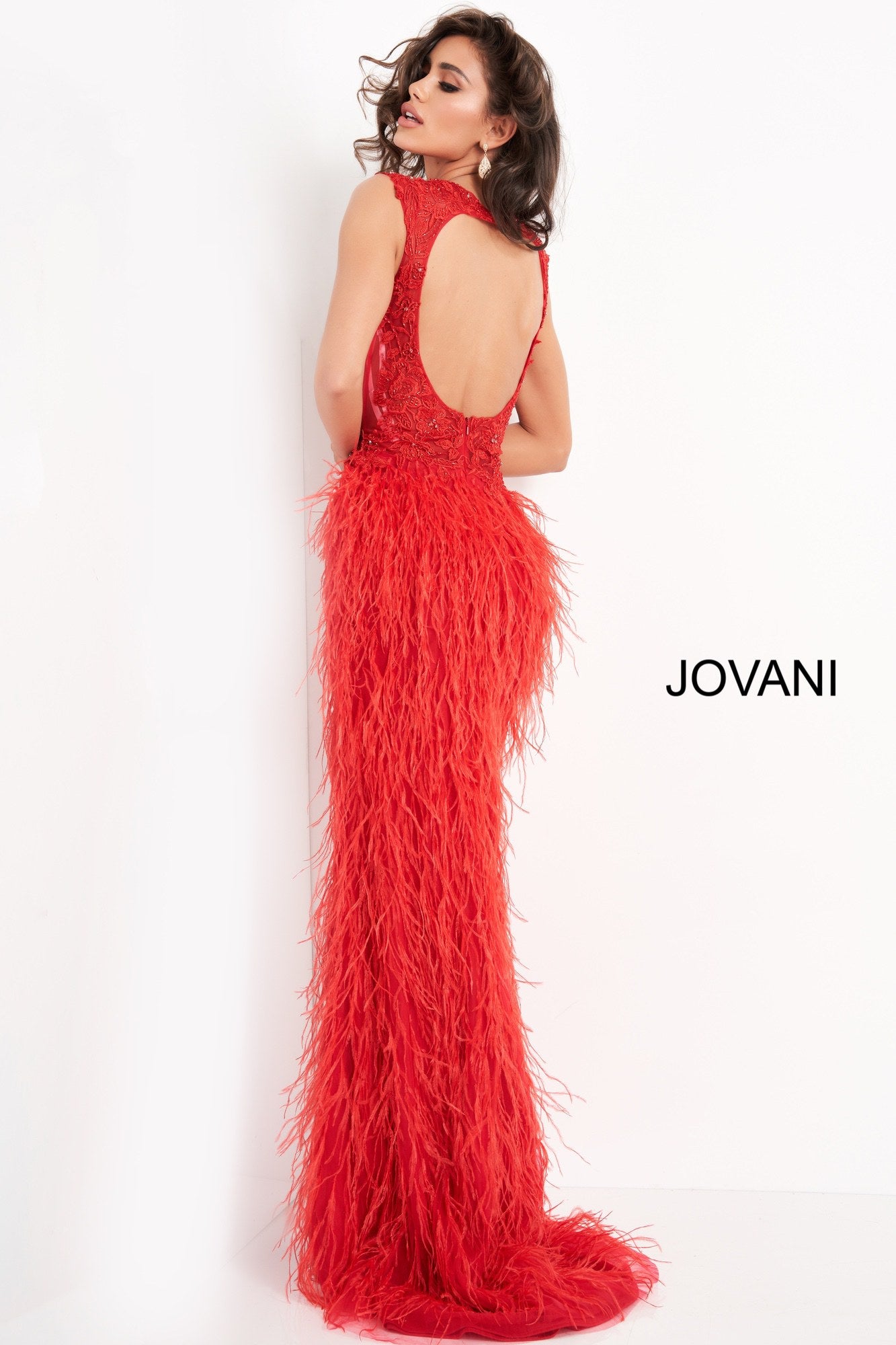 Jovani 06446 is a Gorgeous Red Carpet Ready Formal wear style! Featuring a fitted Plunging V Neck sheer lace embellished bodice with cap sleeves. Lush feather accented skirt with slit and sweeping train. This Prom Dress Features a backless cutout sheer back. Perfect pageant gown. Available Sizes: 00,0,2,4,6,8,10,12,14,16,18,20,22,24  Available Colors: BLUSH, LIGHT-BLUE, OFF-WHITE, RED