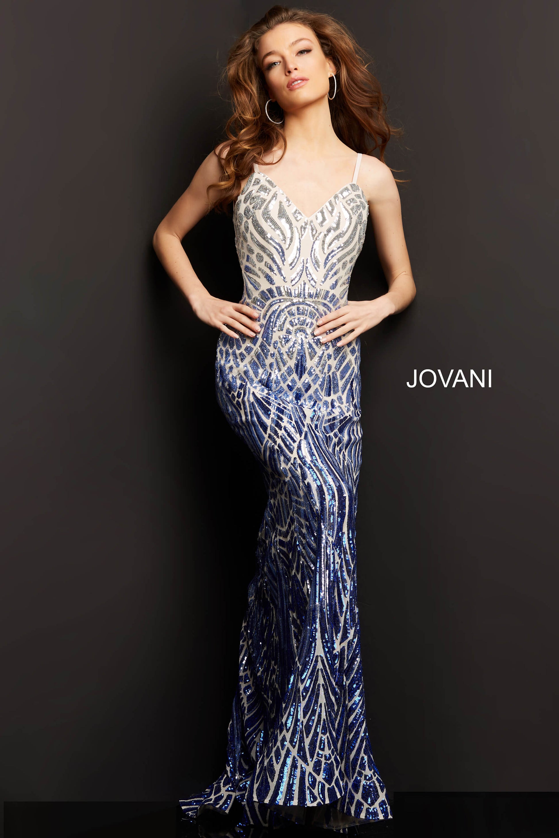 Jovani 06450 is a Gorgeous Long Fitted mermaid Formal evening gown. This Prom Dress Features an open Back with spaghetti straps. Ombre Sequin Color Shift on this Mermaid Pageant Dress. Lush Trumpet skirt with a sweeping train. Fully Embellished sequin Geometric pattern to accentuate any figure!  Available Sizes: 6  Available Colors: silver/royal