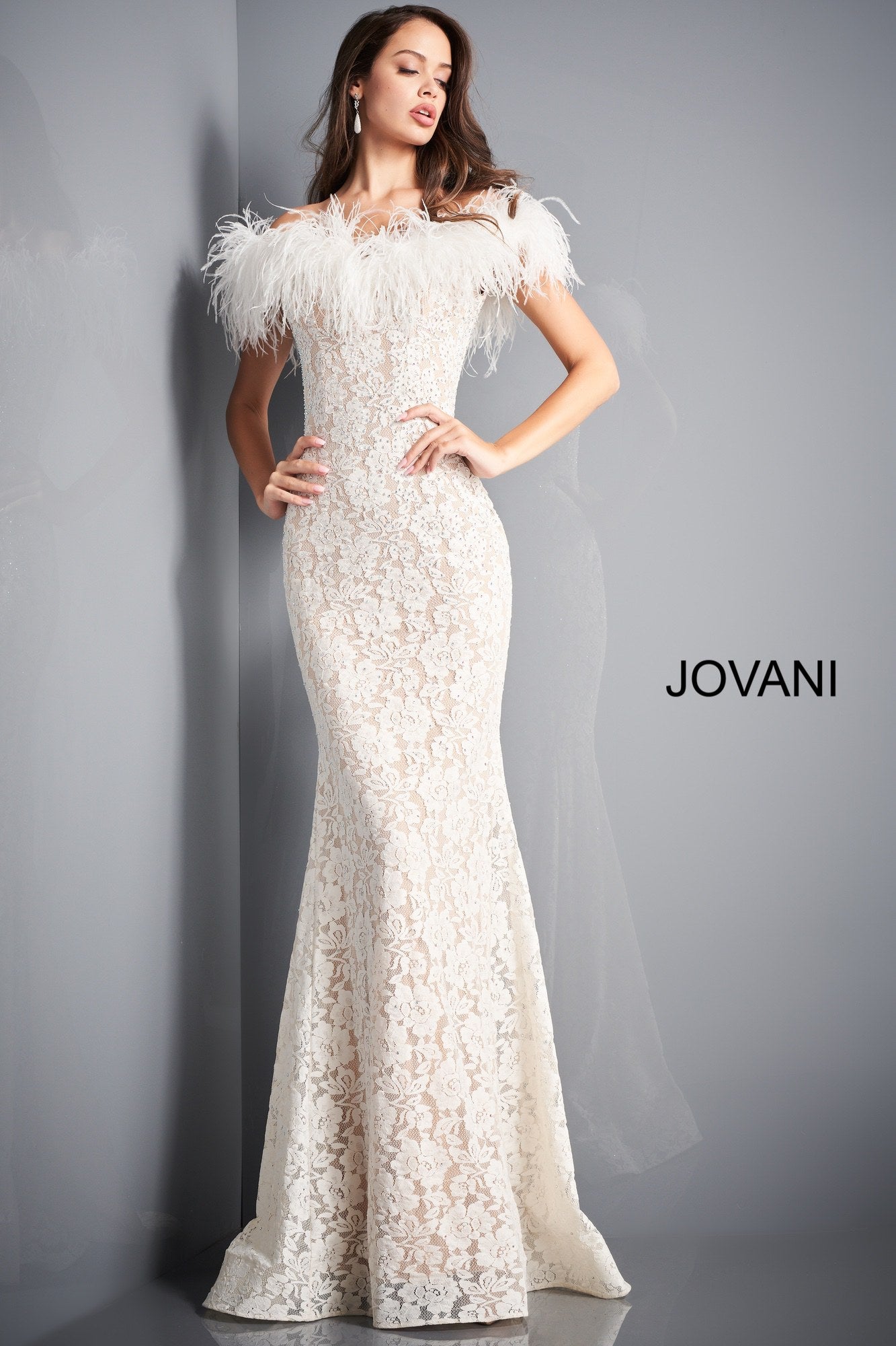 Jovani 06451 is a stunning long fitted lace formal evening gown. Lush Feather accented off the shoulder sleeves. Fit & Flare silhouette with a lush sweeping train with horse hair trim. Fully embellished with scattered crystal rhinestones. sweeping train. Wedding reception dress. prom dress. pageant gown. Available Sizes: 00,0,2,4,6,8,10,12,14,16,18,20,22,24  Available Colors: BLACK, EMERALD, IVORY, LIGHT-BLUE, NAVY, RED