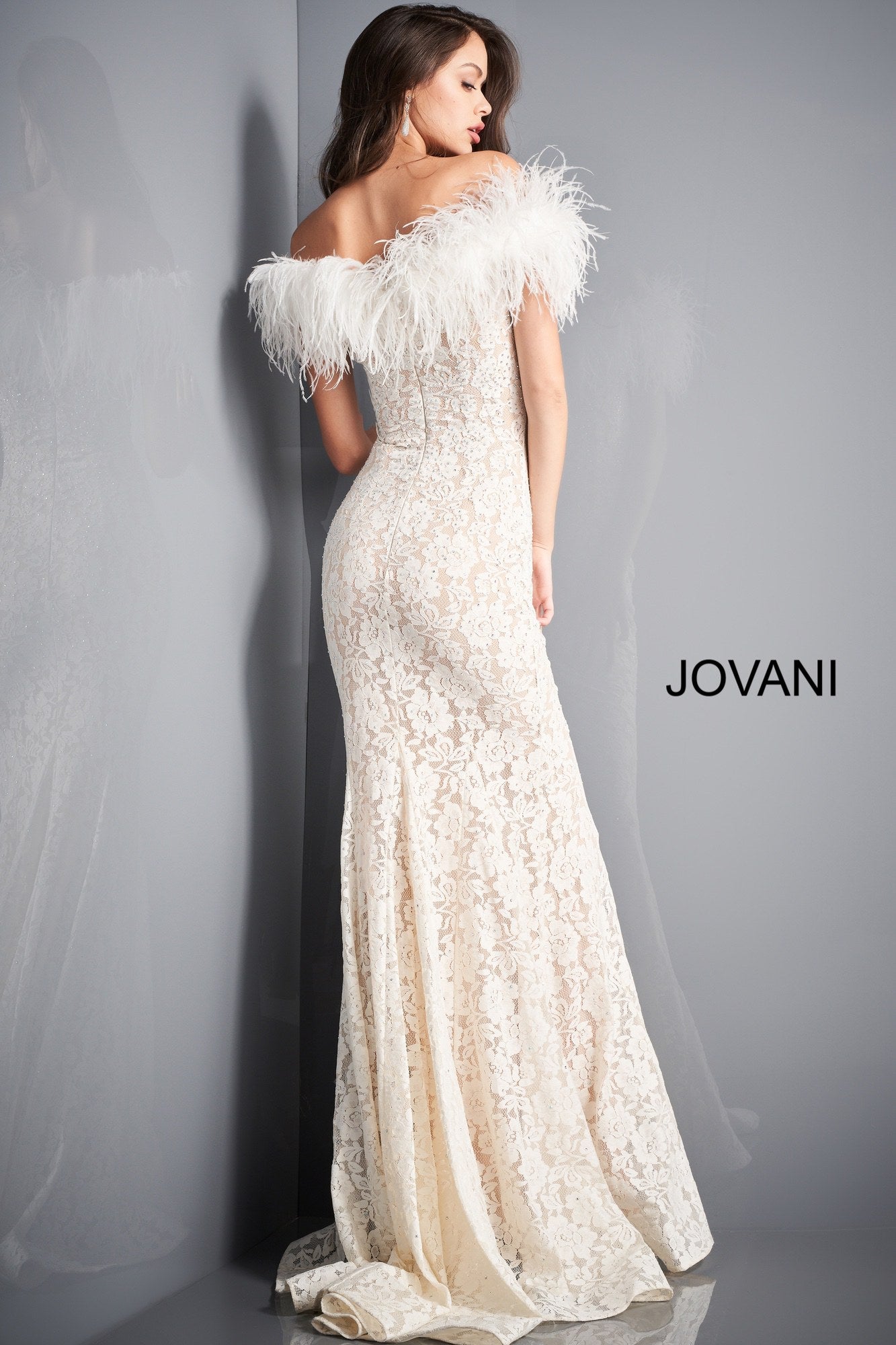 Jovani 06451 is a stunning long fitted lace formal evening gown. Lush Feather accented off the shoulder sleeves. Fit & Flare silhouette with a lush sweeping train with horse hair trim. Fully embellished with scattered crystal rhinestones. sweeping train. Wedding reception dress. prom dress. pageant gown. Available Sizes: 00,0,2,4,6,8,10,12,14,16,18,20,22,24  Available Colors: BLACK, EMERALD, IVORY, LIGHT-BLUE, NAVY, RED
