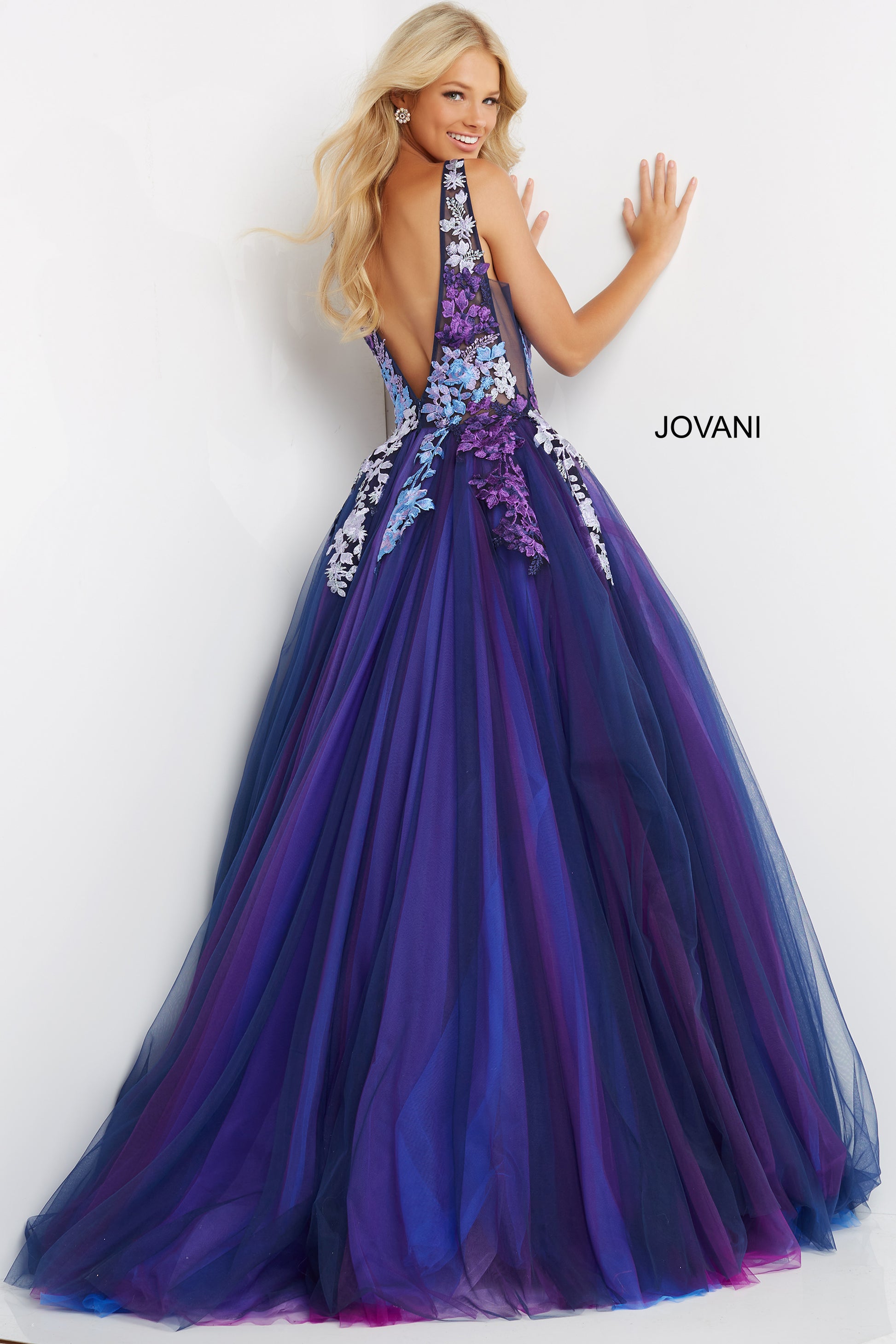 Jovani 06807 Navy Multi Long Ballgown Prom Dress. Floor length navy multi Jovani prom ballgown 06807 features floral embroidered sleeveless bodice with plunging V neck and open back.