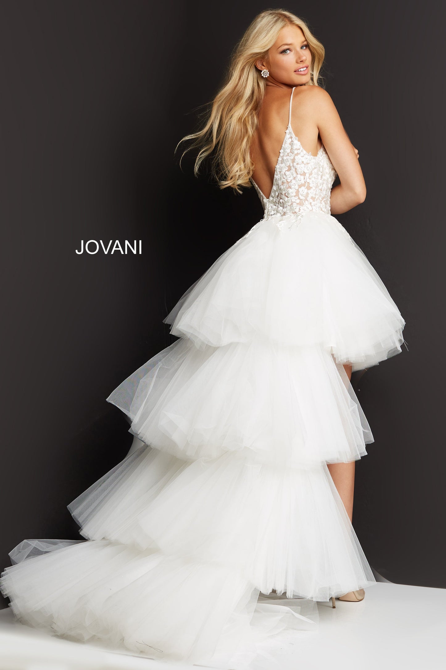 Jovani 07263High Low Prom Dress Pageant Gown.  This Jovani 07263  formal gown features a floral embroidered sheer bodice with a mesh insert plunging neckline, spaghetti straps and pleated layers of long train. 