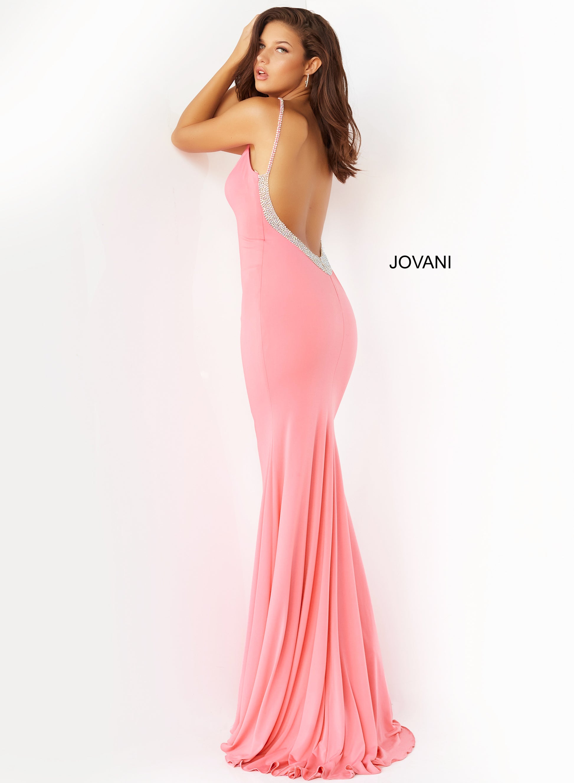 The Jovani 07297 Hot Pink Backless V-Neck Prom Dress is the epitome of elegance and glamour. This form-fitting prom dress is designed to hug your curves in all the right places and features a hot pink hue and a mesmerizing V neckline. The embellished spaghetti straps add a touch of shimmer and sparkle, while the low back, adorned with stones, gives a hint of sexiness to this stunning gown.