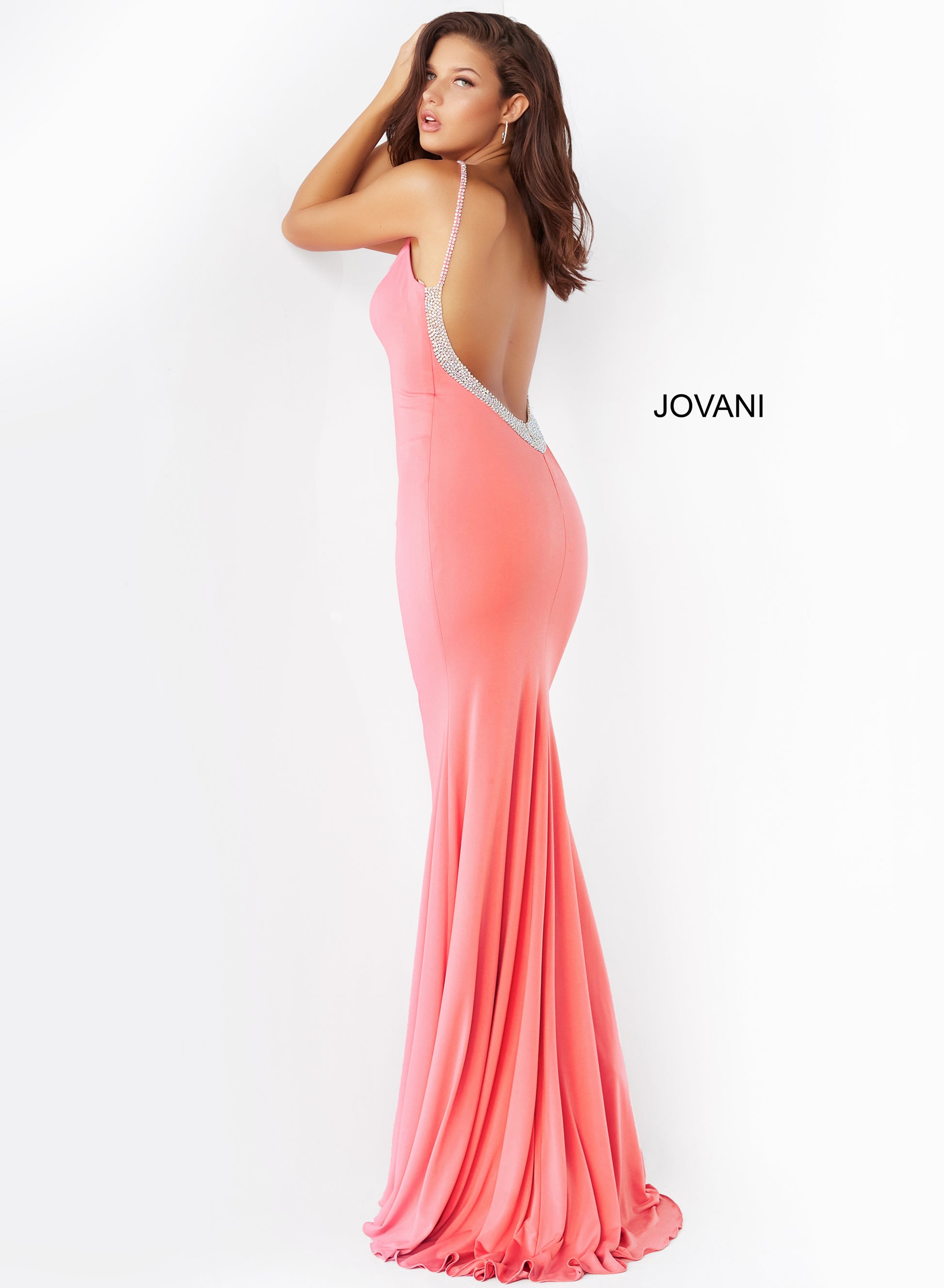 The Jovani 07297 Hot Pink Backless V-Neck Prom Dress is the epitome of elegance and glamour. This form-fitting prom dress is designed to hug your curves in all the right places and features a hot pink hue and a mesmerizing V neckline. The embellished spaghetti straps add a touch of shimmer and sparkle, while the low back, adorned with stones, gives a hint of sexiness to this stunning gown.