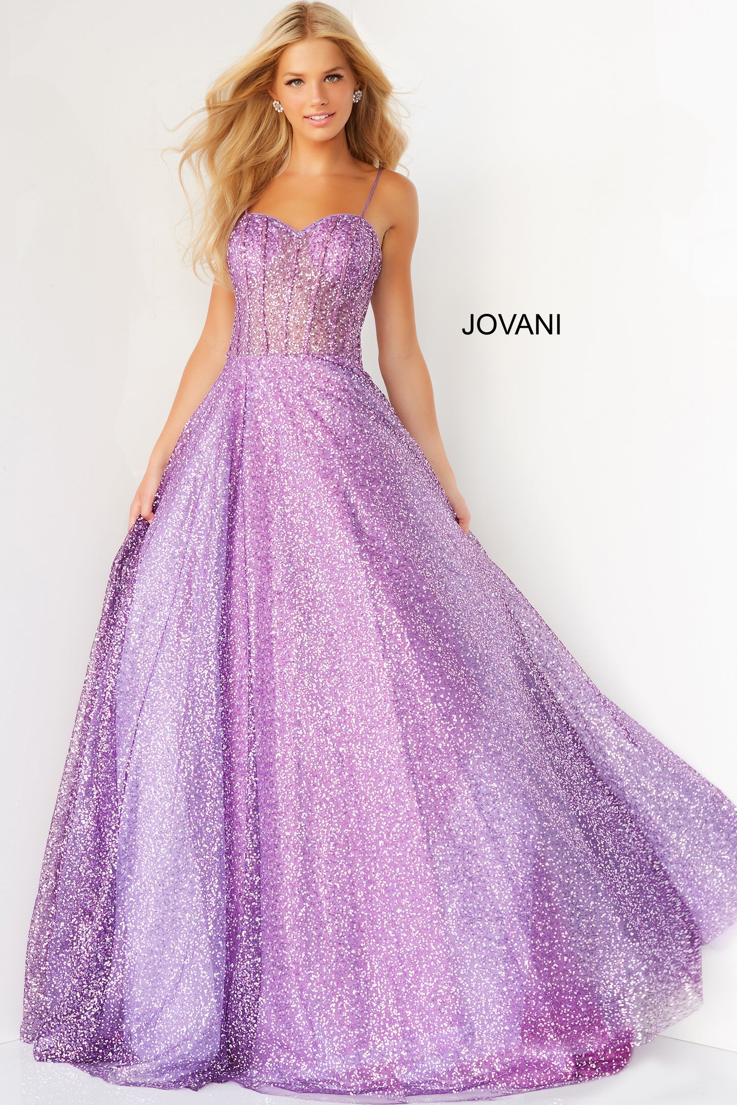 Jovani 07423 Long Ballgown Prom Pageant Gown.  This Jovani purple prom ballgown is styled in sequin net, featuring a sheer corset bodice with a sweetheart neckline, spaghetti straps.