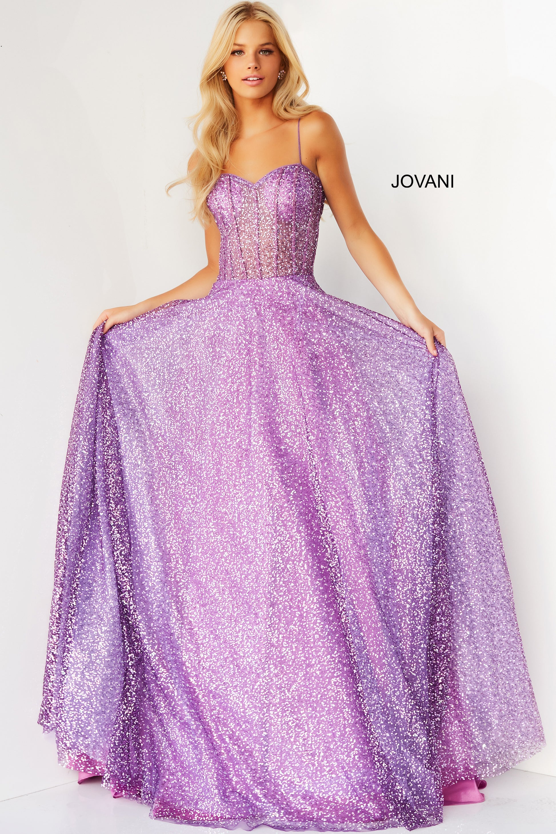 Jovani 07423 Long Ballgown Prom Pageant Gown.  This Jovani purple prom ballgown is styled in sequin net, featuring a sheer corset bodice with a sweetheart neckline, spaghetti straps.