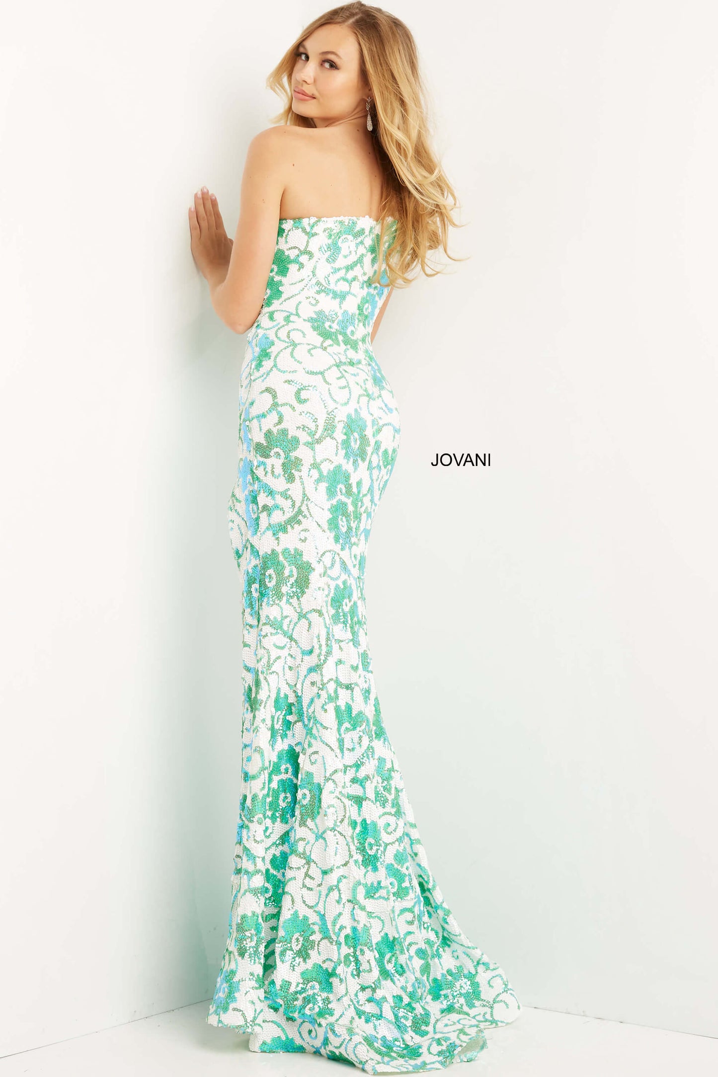 Jovani 08256 Long One Shoulder Sequin Floral Design Prom Pageant Gown. Jovani 08256 one-shoulder sequin prom dress is perfect for those who want to make a statement on their big night. The dress features a fitted silhouette that hugs the body in all the right places. The sequin fabric adds a touch of sparkle and shine, ensuring you'll turn heads as soon as you enter the room. The one-shoulder design adds a touch of elegance to the overall look, making it perfect for a prom or any formal event!
