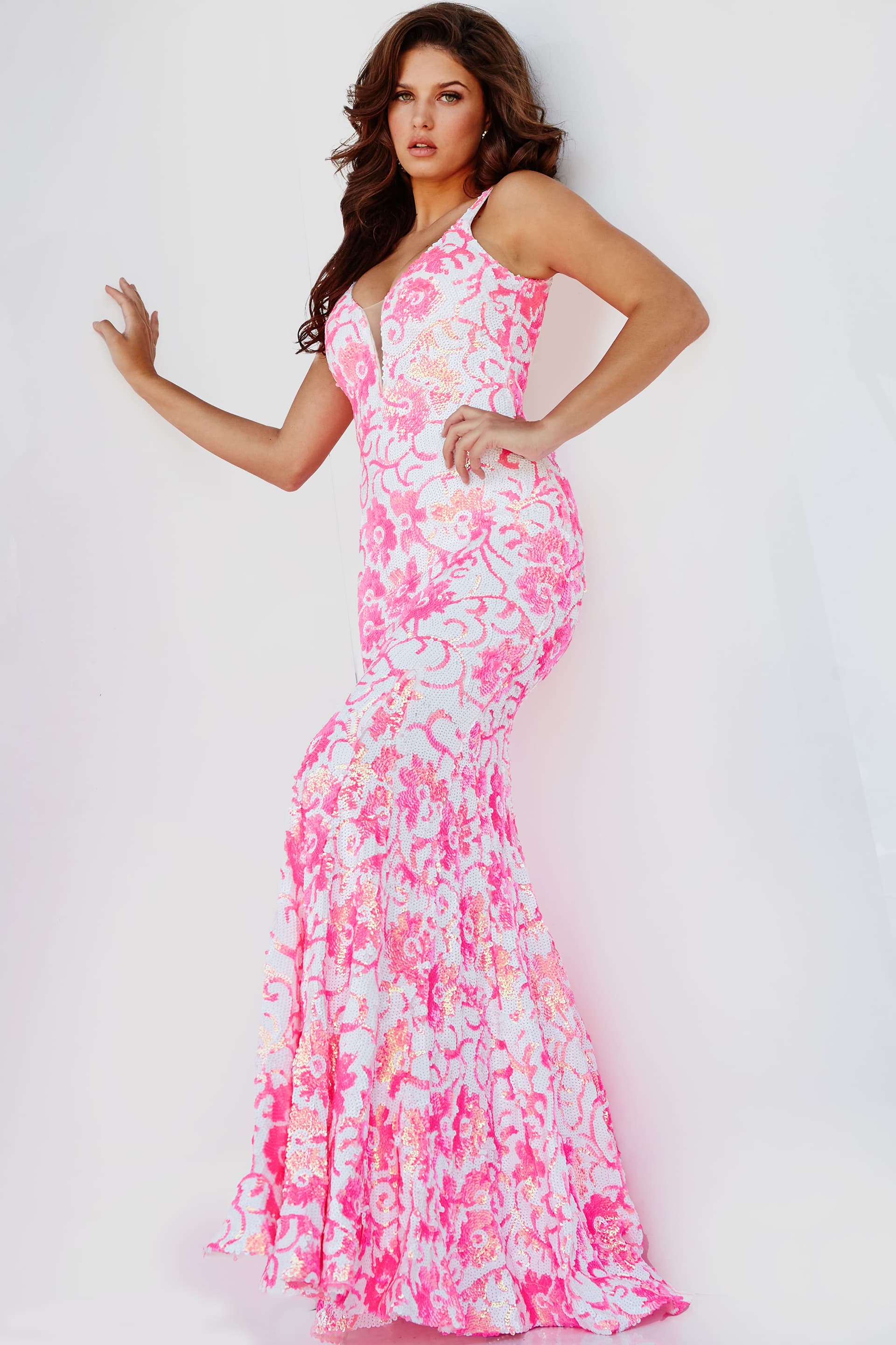 Jovani 08527 is a stunning formal prom & pageant dress. Featuring a floral design in sequin accents. Plunging V neckline. Lush sweeping train & Open midrise back. Great Gown for any formal event! This gown reveals a mermaid silhouette lavishly studded with floral sequin embellishment throughout finished with a sweep train.   Available Sizes: 00,0,2,4,6,8,10,12,14,16,18,20,22,24  Available Colors:  IVORY/BLUE, IVORY/EMERALD, IVORY/HOT-PINK, IVORY/LIGHT ORANGE, IVORY/PURPLE, WHITE/AB