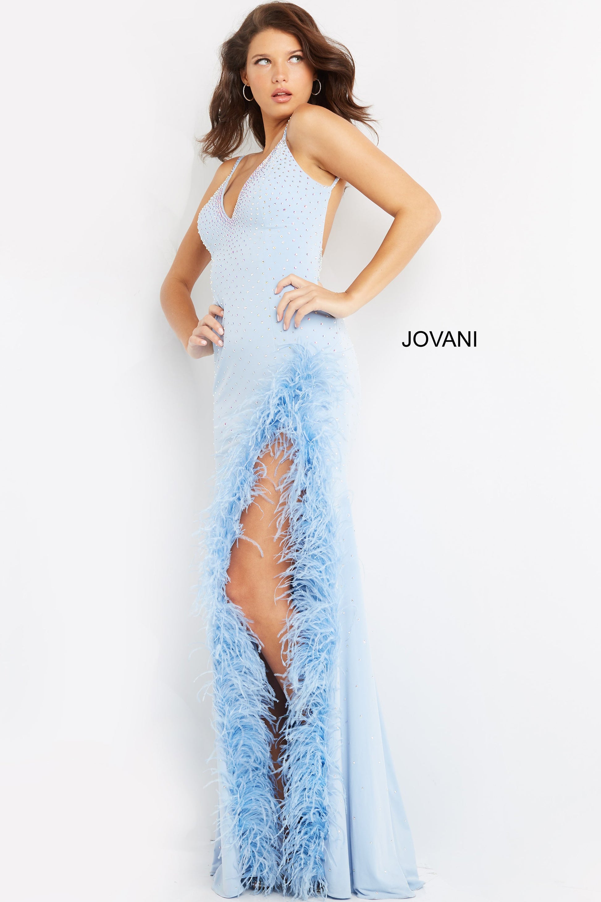 Jovani 08283  Light Blue Prom, Pageant and Formal Evening Wear Dress.  This extravagant evening gown has a v neckline and low back.  It is fitted and beaded with a feather trimmed slit. Make a statement in this stand out prom dress.
