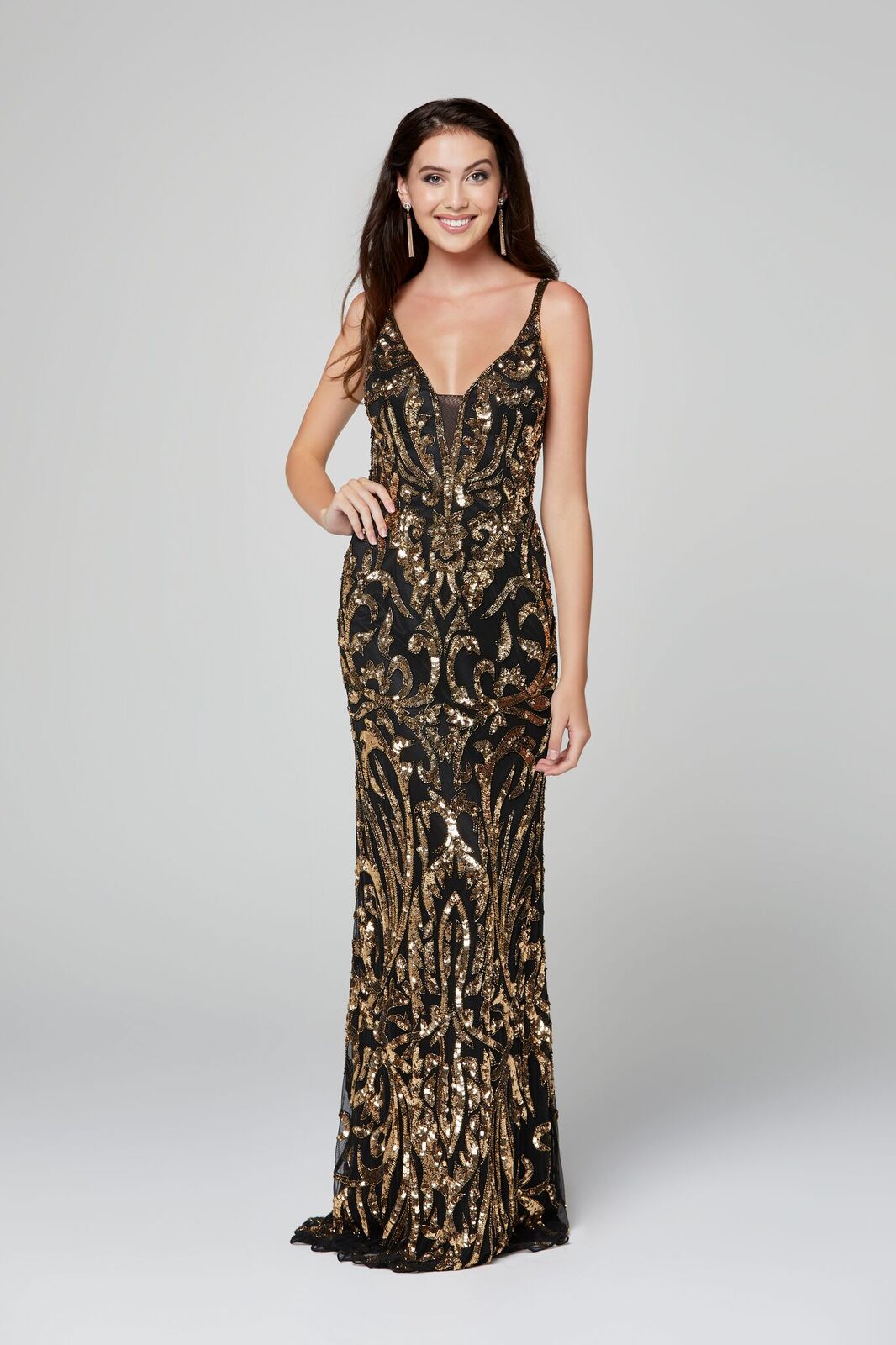 Primavera Couture 3454 is a Sequin Designer Prom, Pageant & Formal Dress. Featuring a Plunging V neckline with mesh panel. Embellished sequins & Hand beading along the entire gown in a damask print. Great evening gown. Open scoop back.