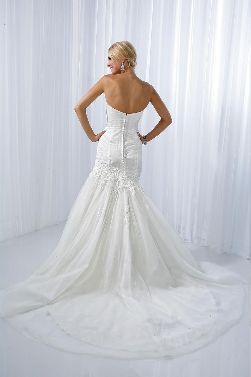 Impression Wedding Dress style 10095. Tulle lace satin dress with lace applique shoulder straps, sweetheart neckline adorned with beaded applique throughout the dress, fit and flare silhouette tulle skirt extend to a chapel length train. removable straps  Available in Size 2 Ivory