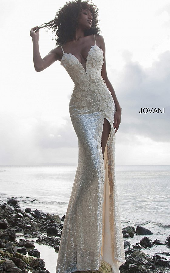 Jovani 1012 This is a Delicate all over sequin Embellished Prom Dress with Floral Appliques. Features a plunging neckline & Slit in the skirt. Small Train in Back.   Details: Sequin fabric, floral appliques, fitted silhouette, high slit skirt with sweeping train, sleeveless bodice, plunging neckline with sheer mesh insert, low back with strap across for support, spaghetti straps over shou