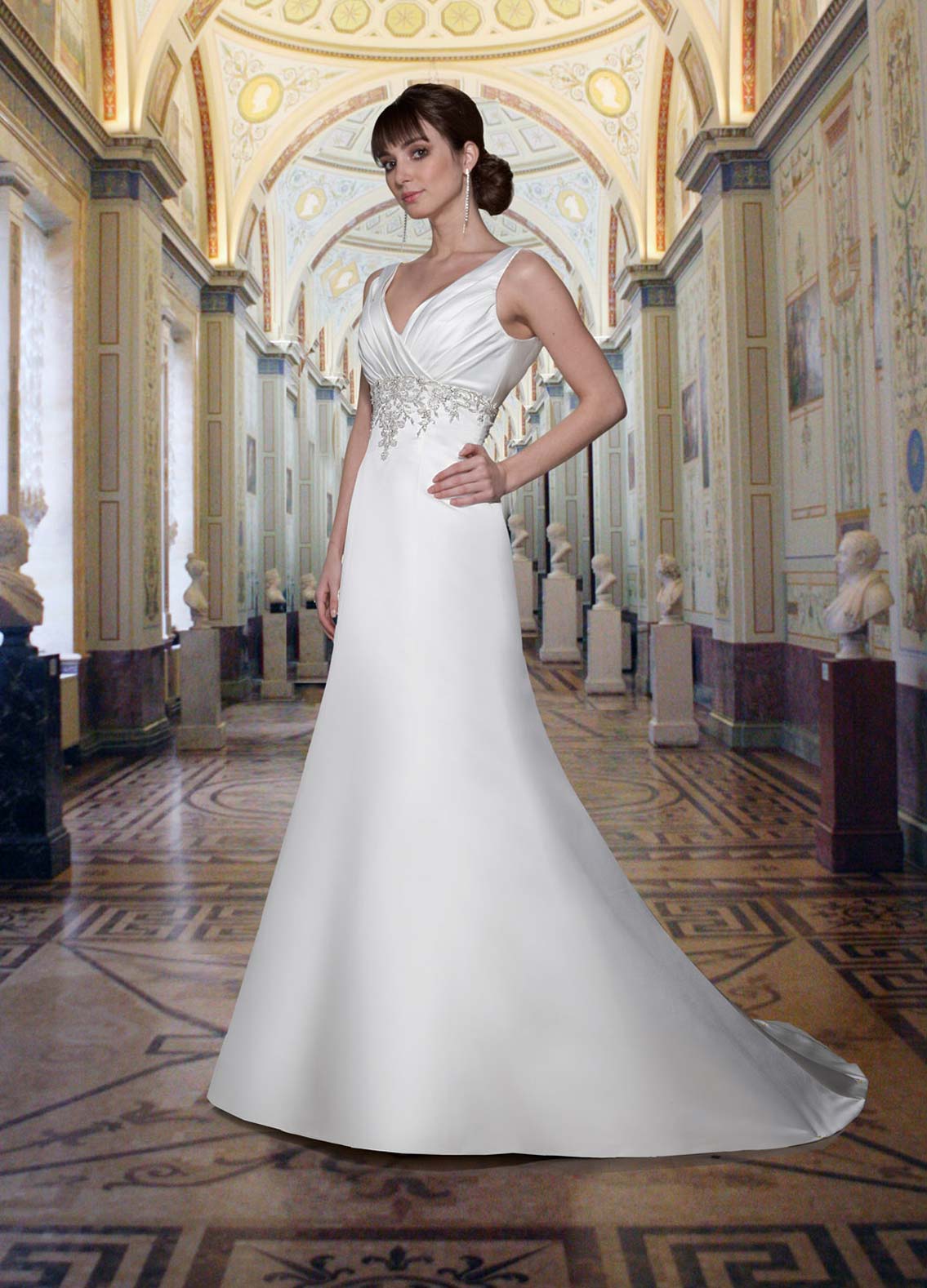 Davinci Bridal 8373 is a Gorgeous Heavy Sating Bridal Gown. This Plus size wedding dress features a Heavy Ivory Satin material with a pleated bodice with a V neckline and wide straps. Detailed Embellishments & Beading accent the waist line all the way around. The intricate beading, sequins & crystal create the illusion of embroidered lace with a more detailed & Glam Affect. Simple A Line silhouette.   Available Sizes: 24  Available Color: Ivory