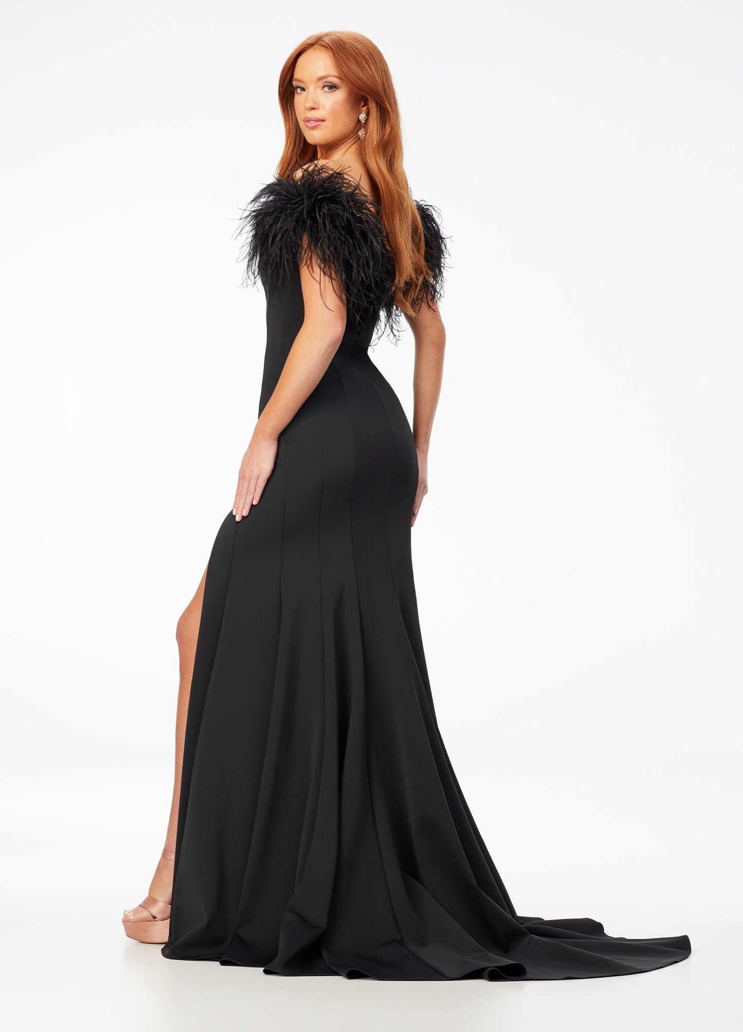 Ashley Lauren 11100 Feather trimmed Jumpsuit. This jumpsuit features a feather boa wrapped around your neckline, arms and back.  The fabric is scuba and it has flare in the pant leg. black