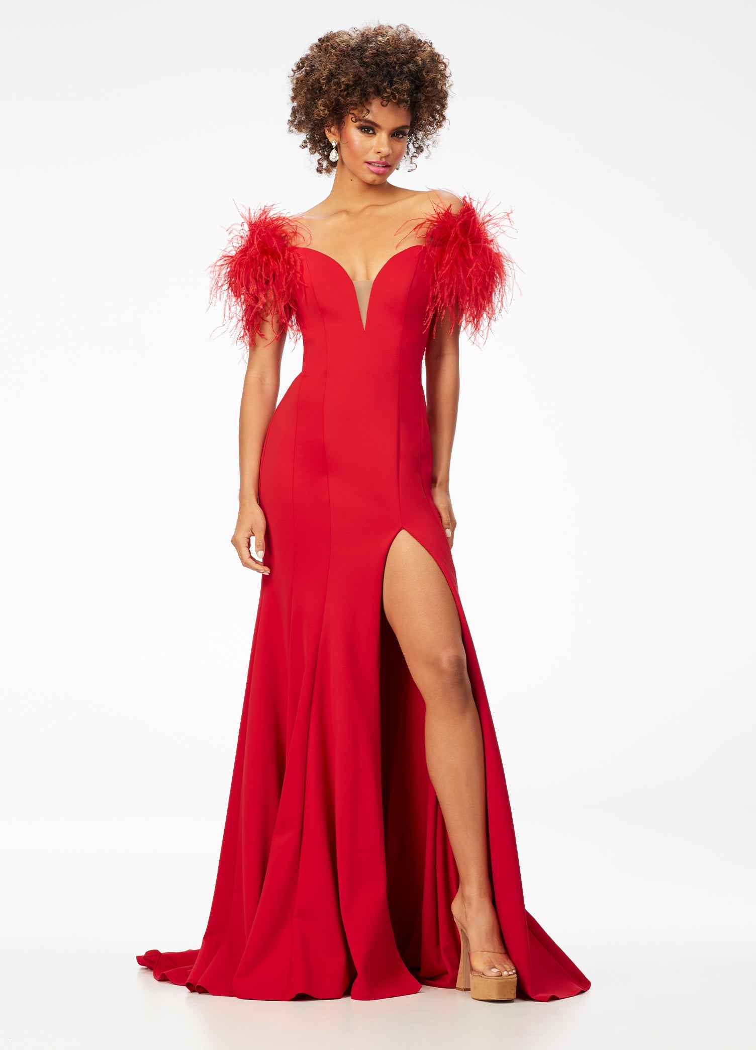 Ashley Lauren 11100 Feather trimmed Jumpsuit. This jumpsuit features a feather boa wrapped around your neckline, arms and back.  The fabric is scuba and it has flare in the pant leg. Red