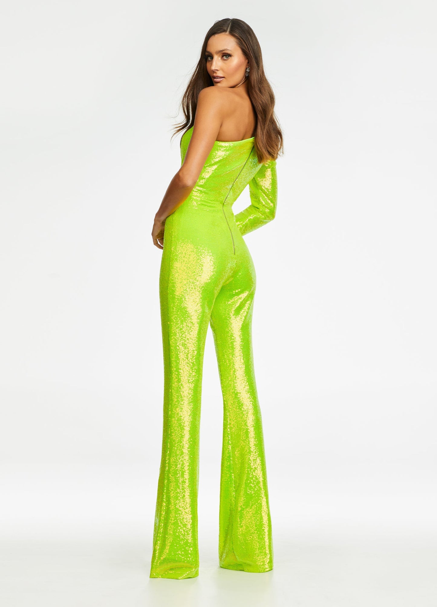 Ashley Lauren 11110 Long Sequin Bell Sleeve Pageant Jumpsuit One Shoulder Bell Bottom We are loving the neon vibes in this sequin one shoulder jumpsuit featuring an industrial zipper back. One Sleeve Exposed Zipper Jumpsuit Sequin Fabric Available Sizes: 0-16 Available Colors: Coral, Lilac, Neon Green, Yellow