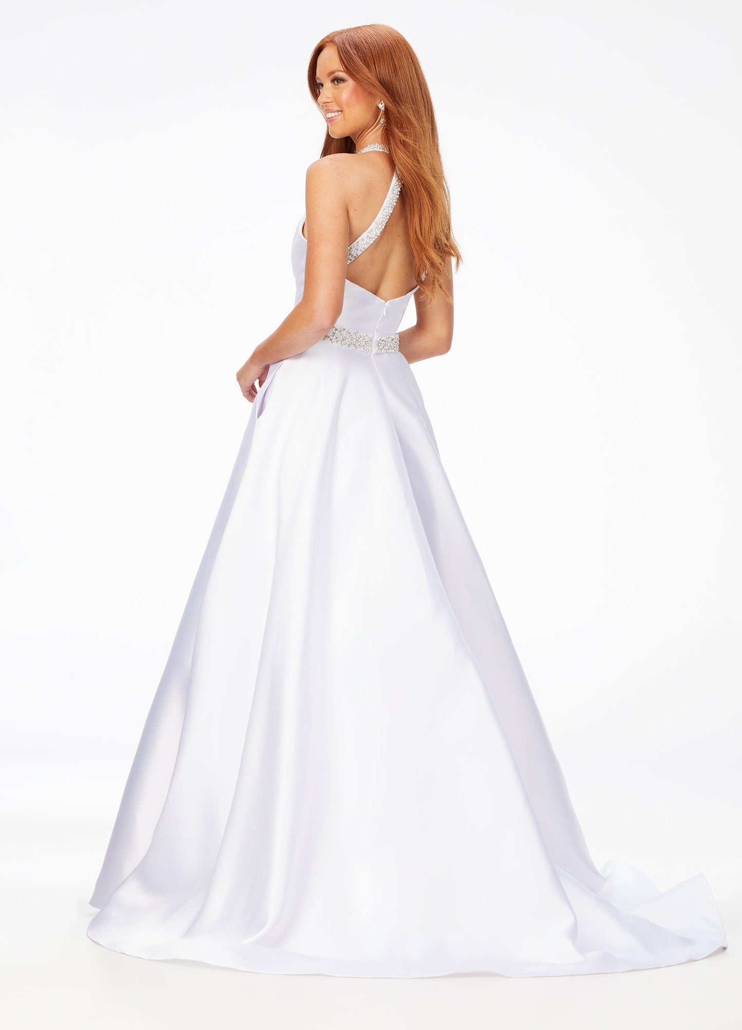 Ashley Lauren 11230 This a line gown features a crystal and pearl encrusted halter neckline and waistline. This gown would be perfect for your next event! Halter Bustier Crystal & Pearl Neckline & Belt Ball Gown Skirt Mikado