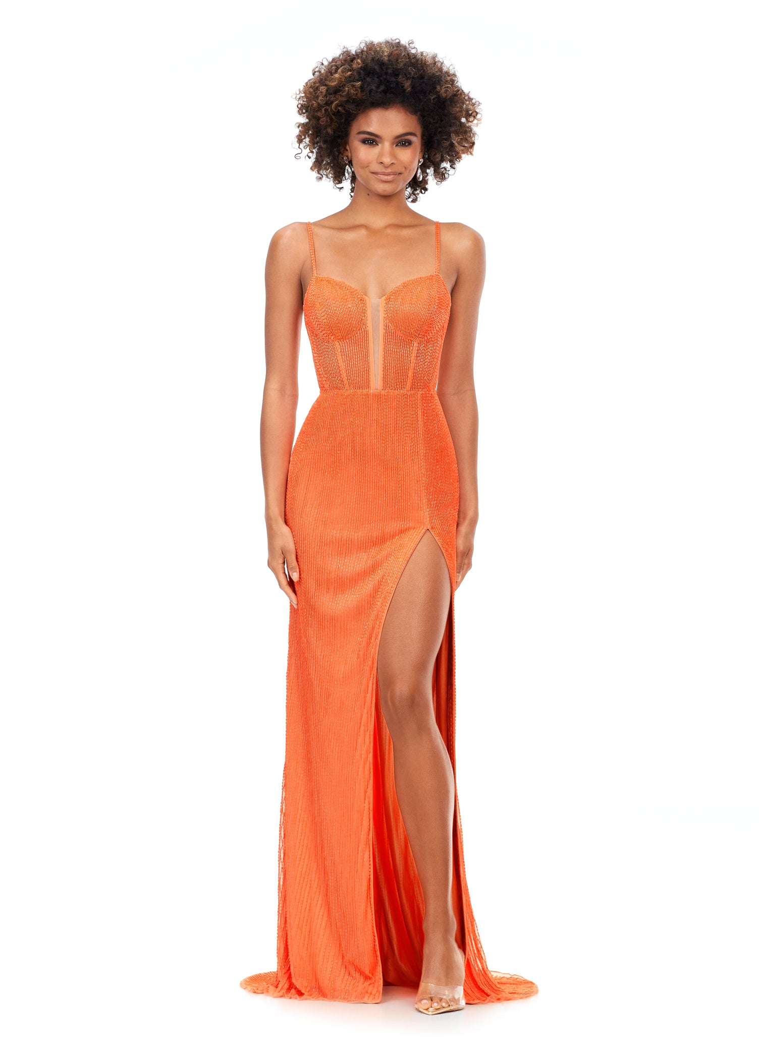 Ashley Lauren 11369 This Coral liquid beaded style features an exposed bustier that is sure to accentuate your curves. The look is complete with sweep train and left leg slit.